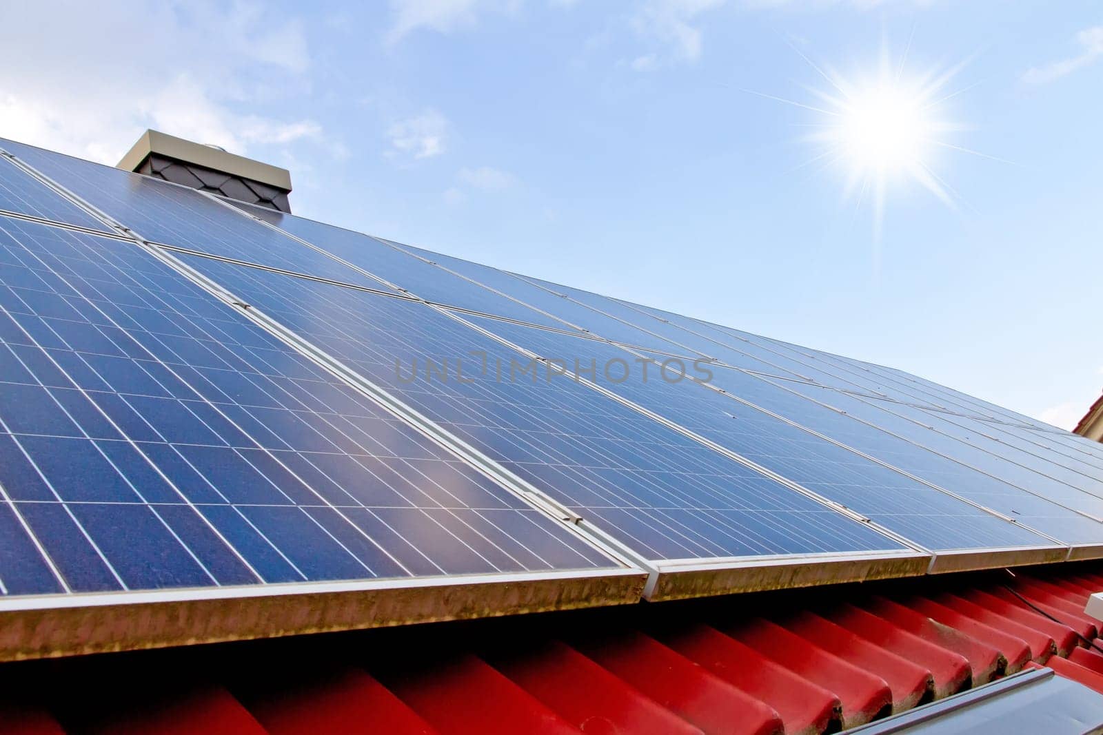 roof with solar panels and sun