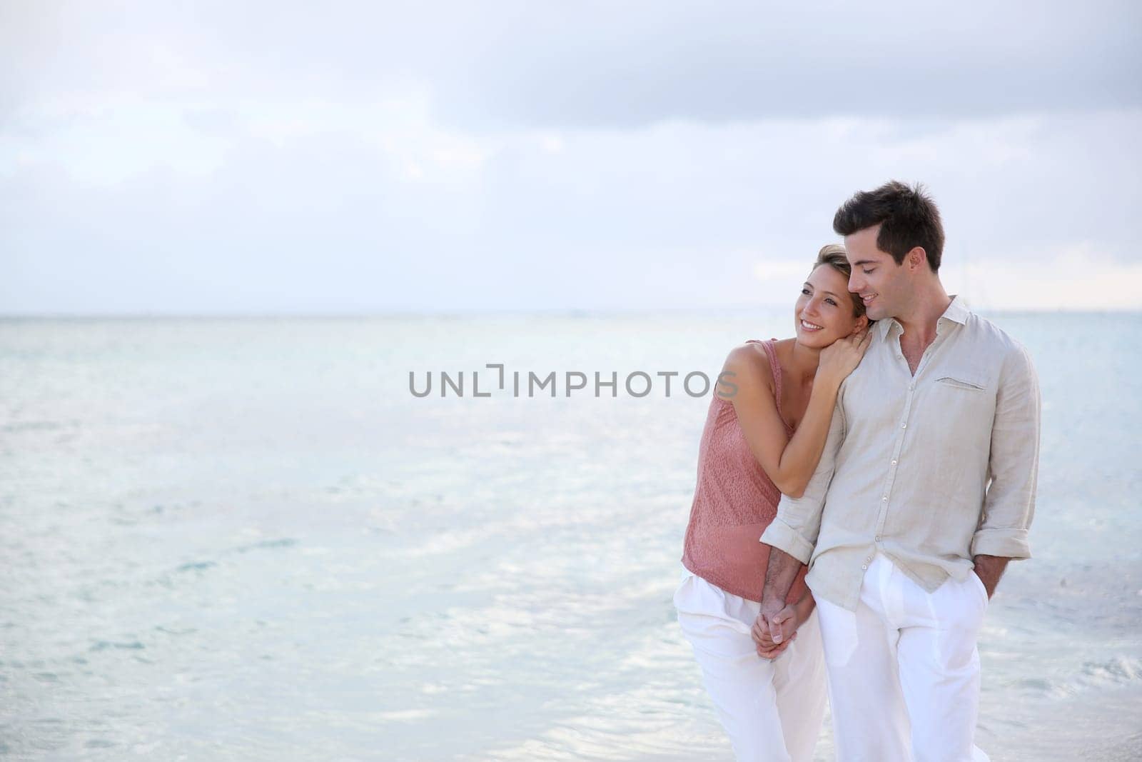 Couple enjoying sunset time at the beach