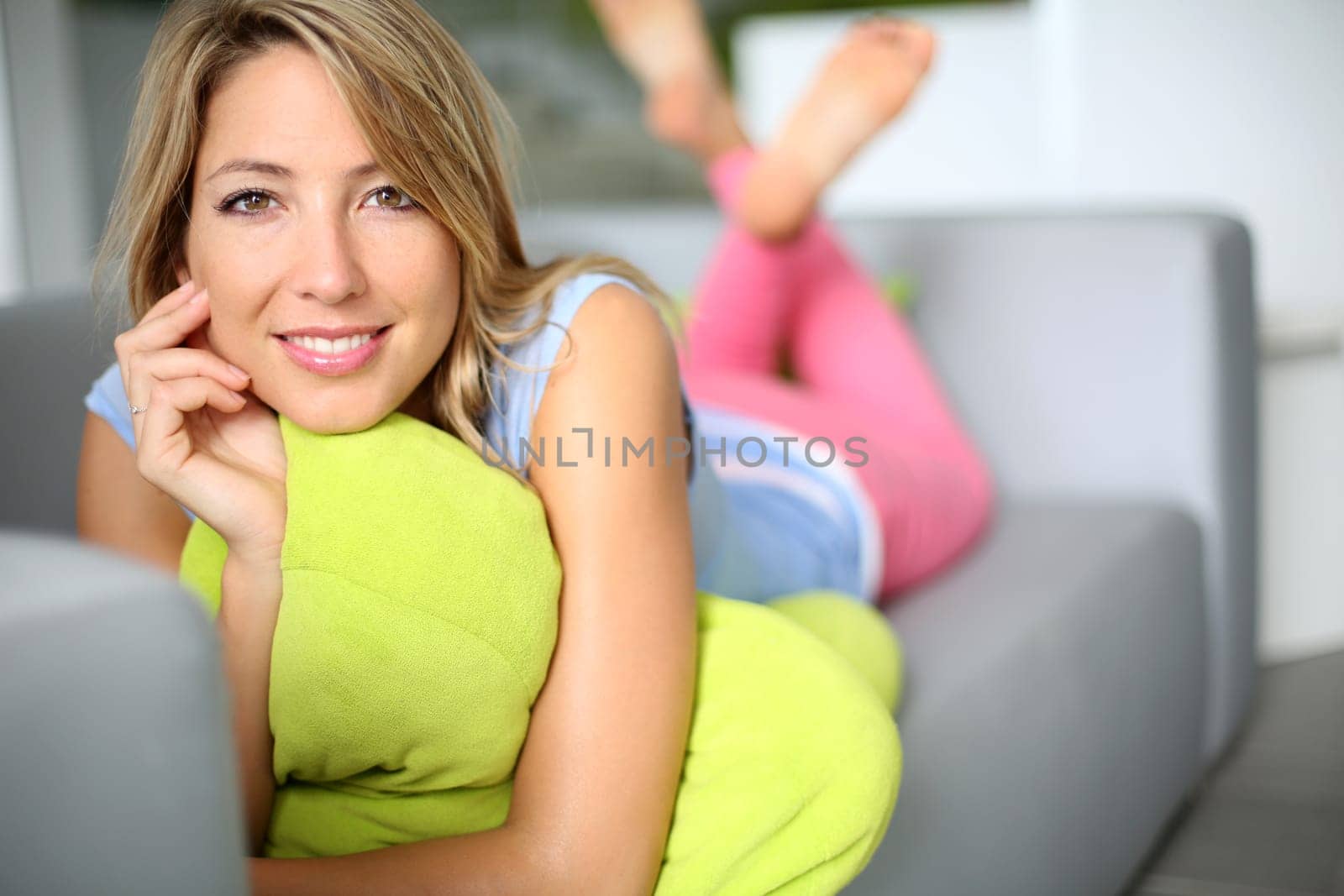 Attractive woman laid on sofa