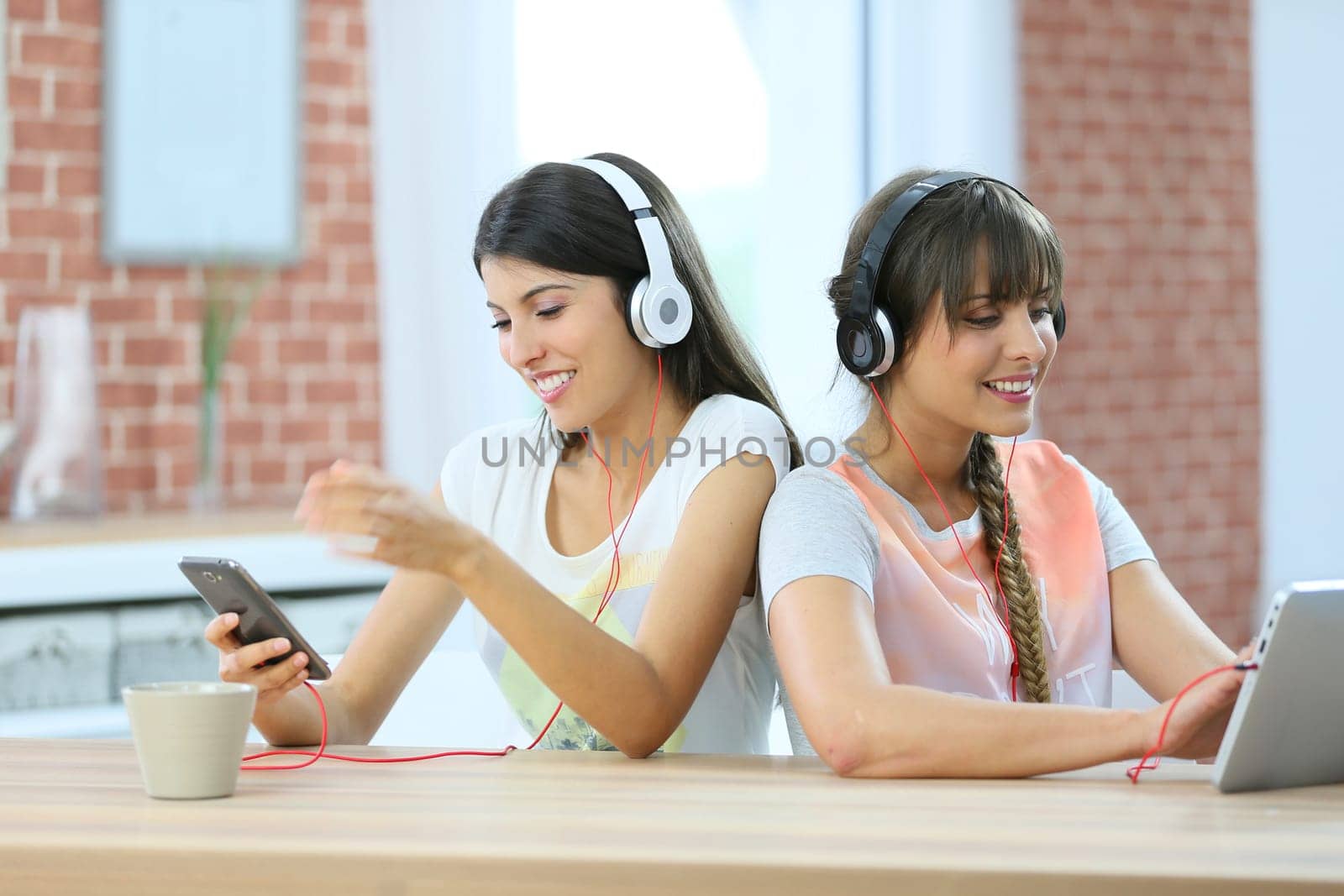 Girl friends connected each one with a different support