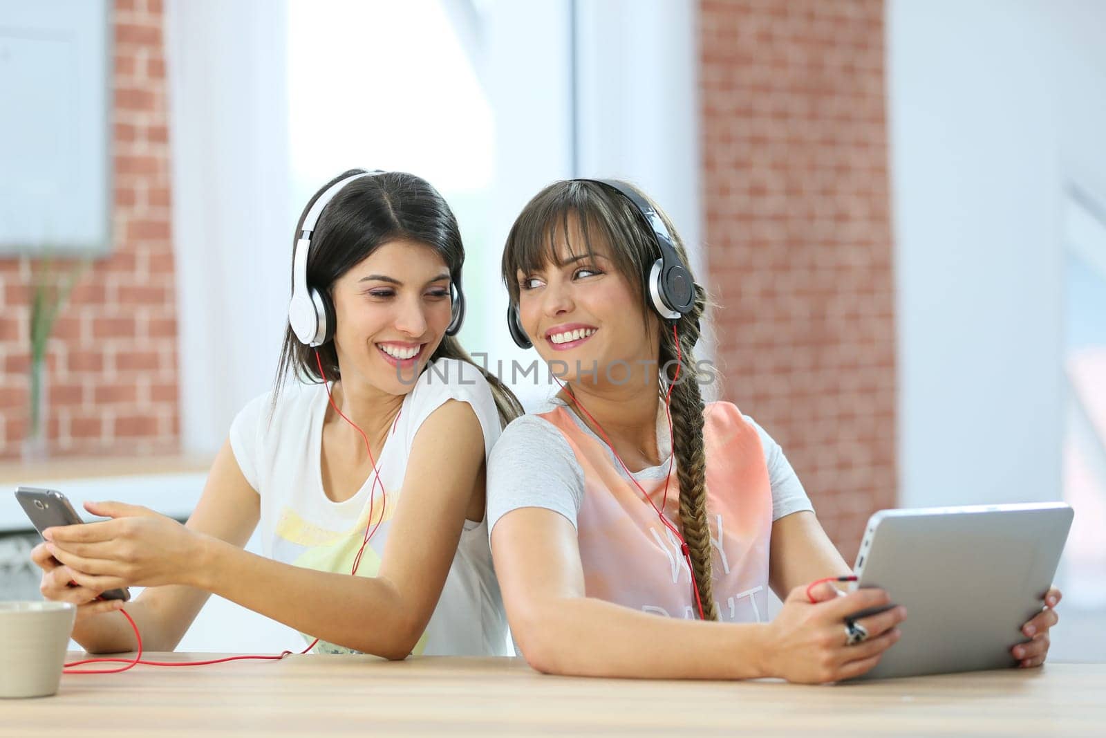 Girl friends connected each one with a different support