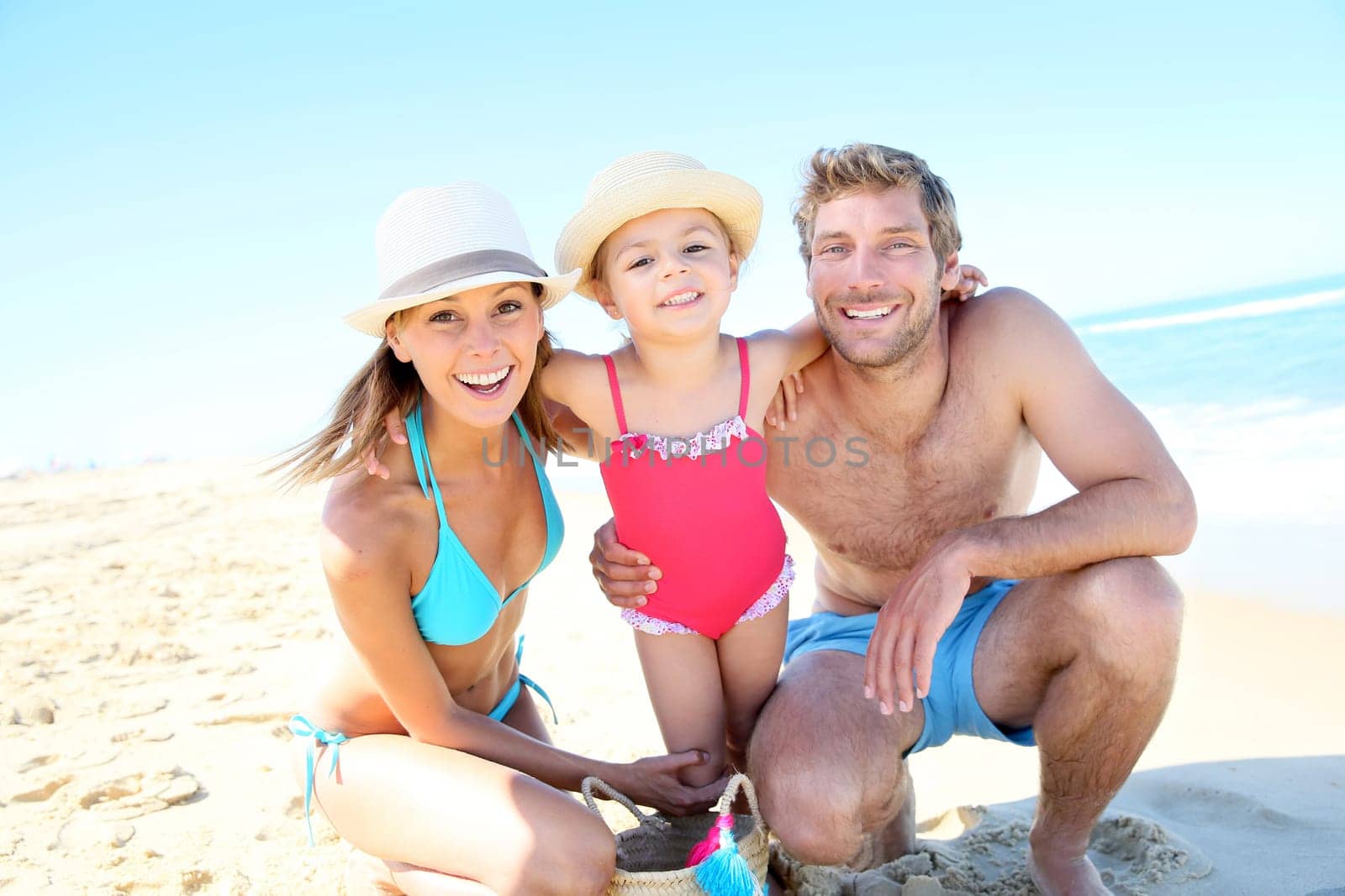 Portrait of happy family at the beach