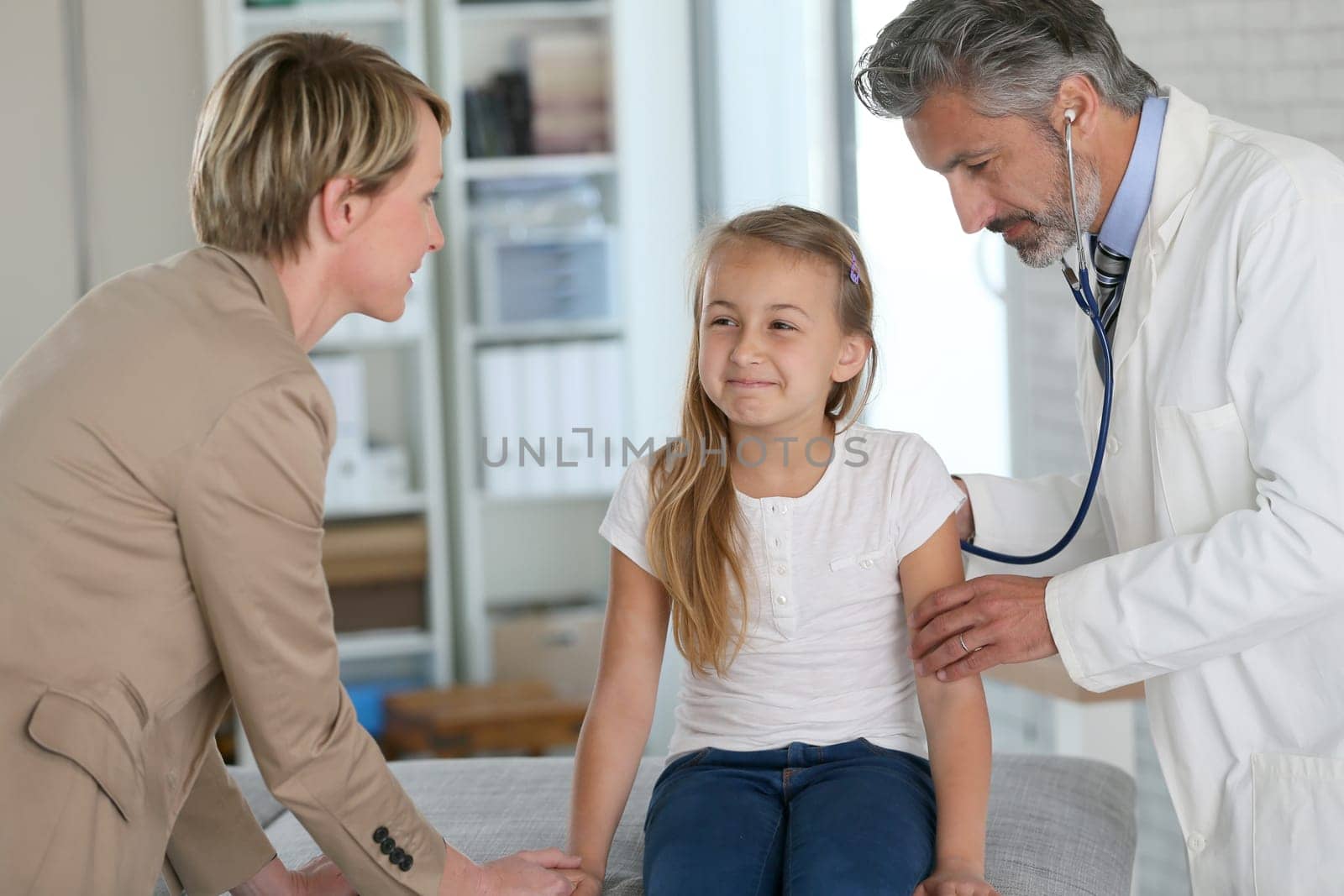 Little girl at doctor's office with mommy
