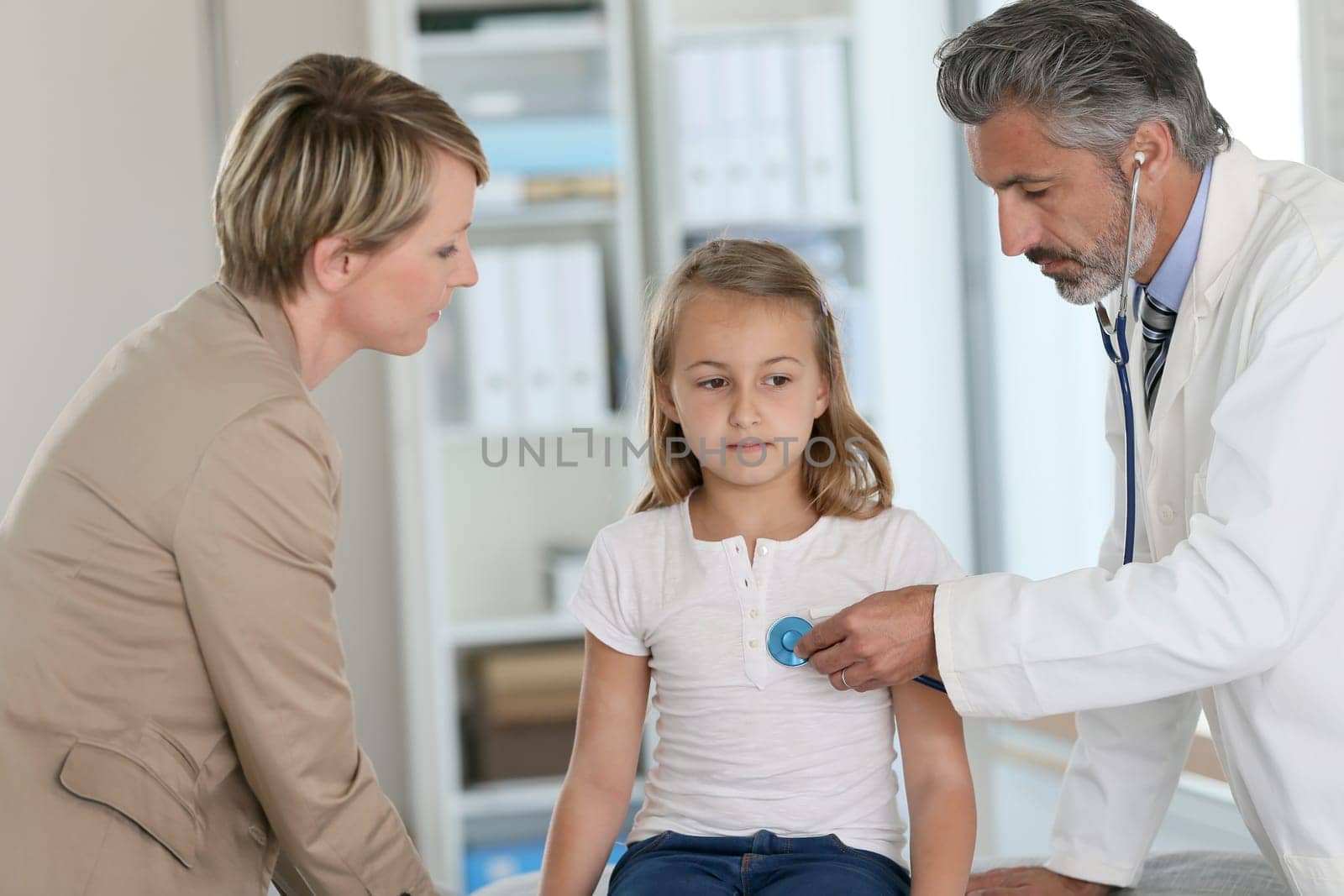 Little girl at doctor's office with mommy