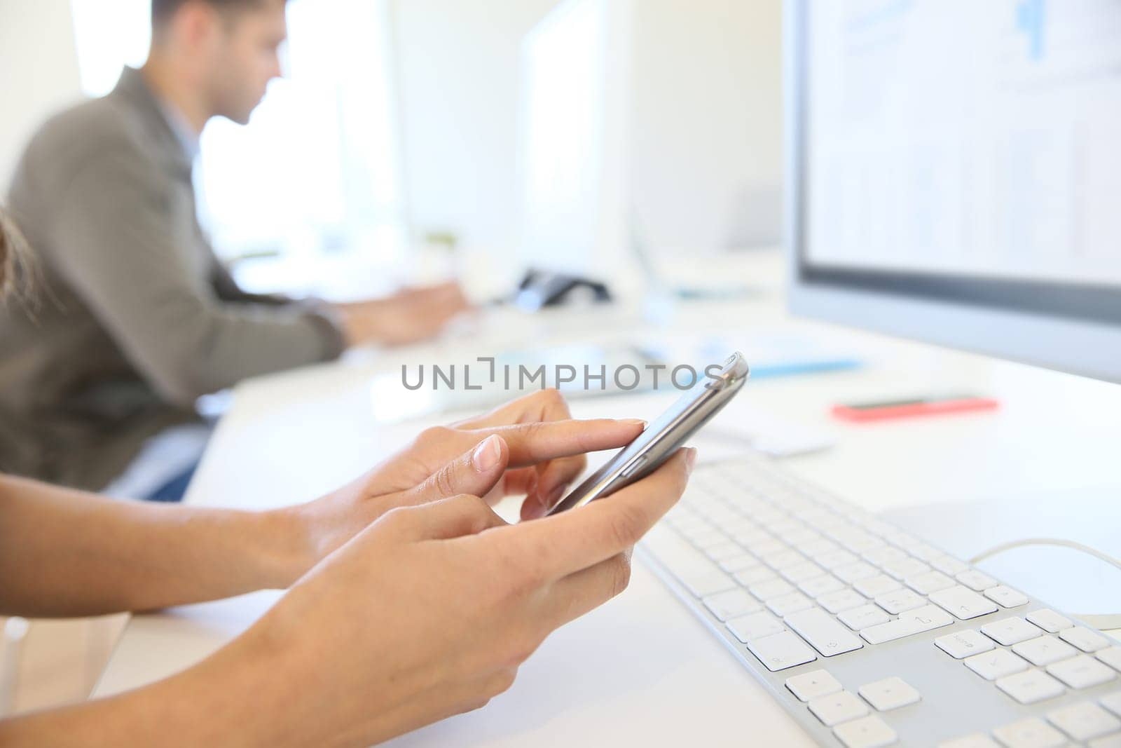 Closeup of hands sliding on smartphone screen