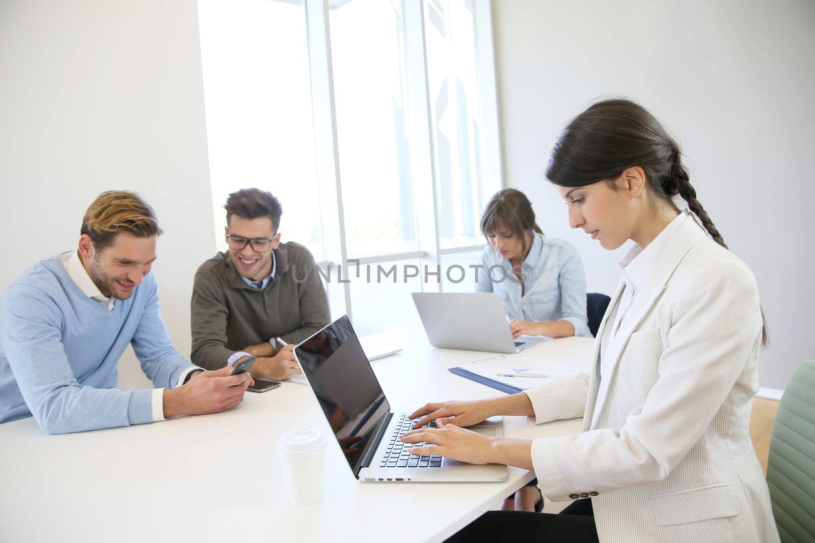 Start-up businesspeople sharing working space