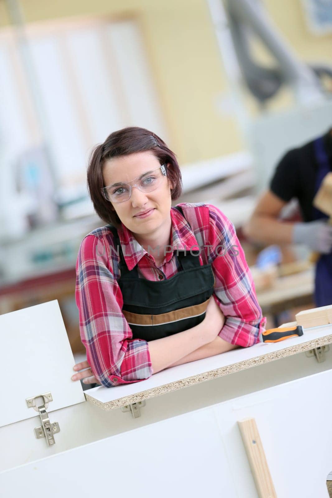 Portrait of young woman in carpentry school