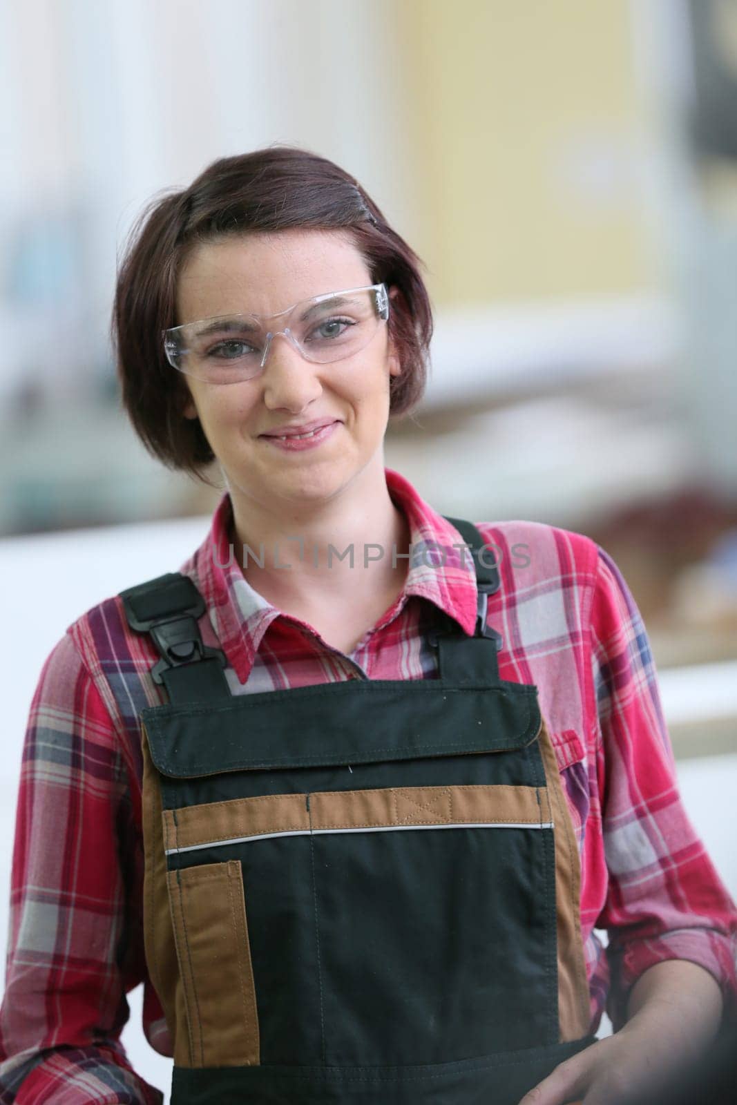 Portrait of young woman in carpentry school