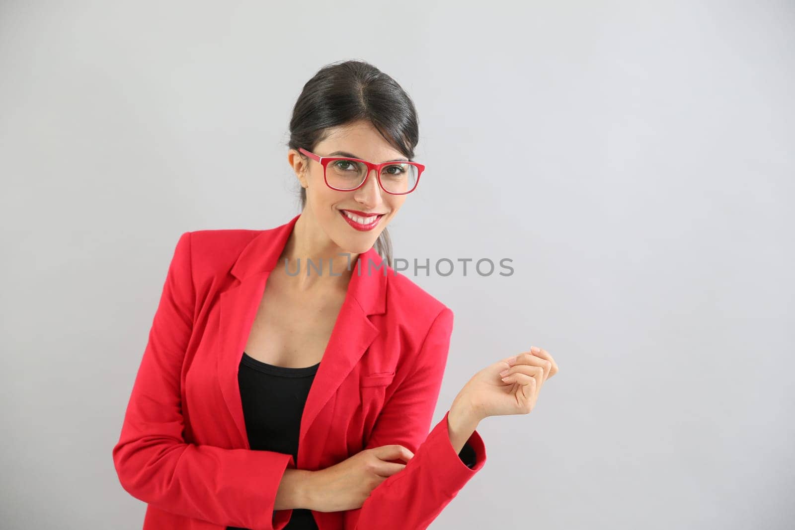 Beautiful brunette girl with red jacket and eyeglasses, isolated