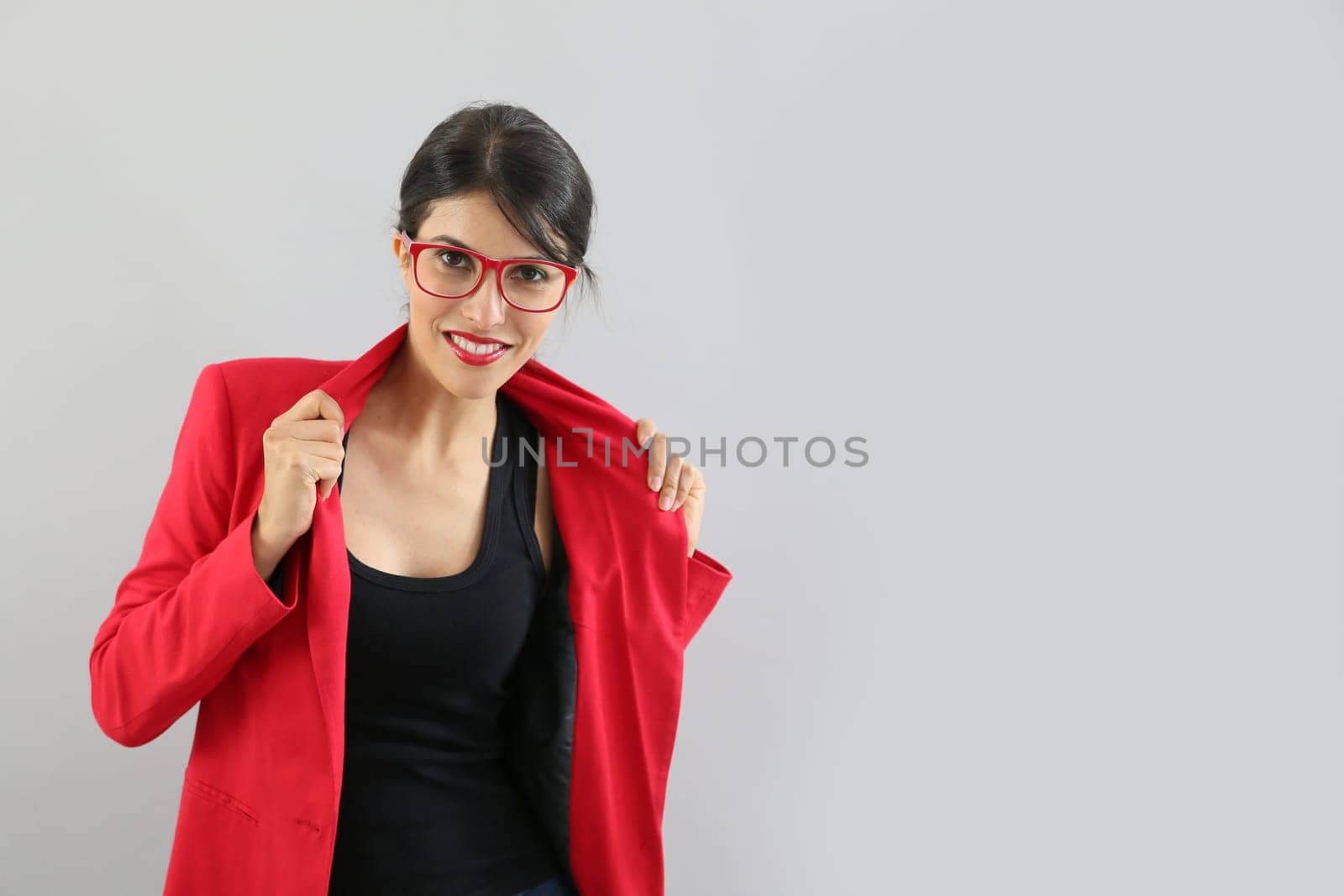 Beautiful brunette girl with red jacket, isolated