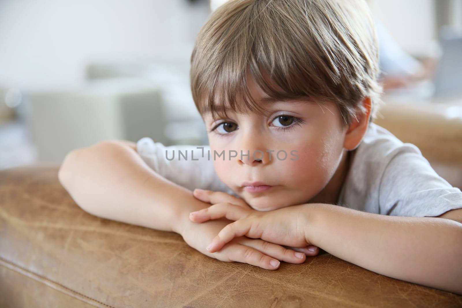 Portrait of cute little boy being thoughtful