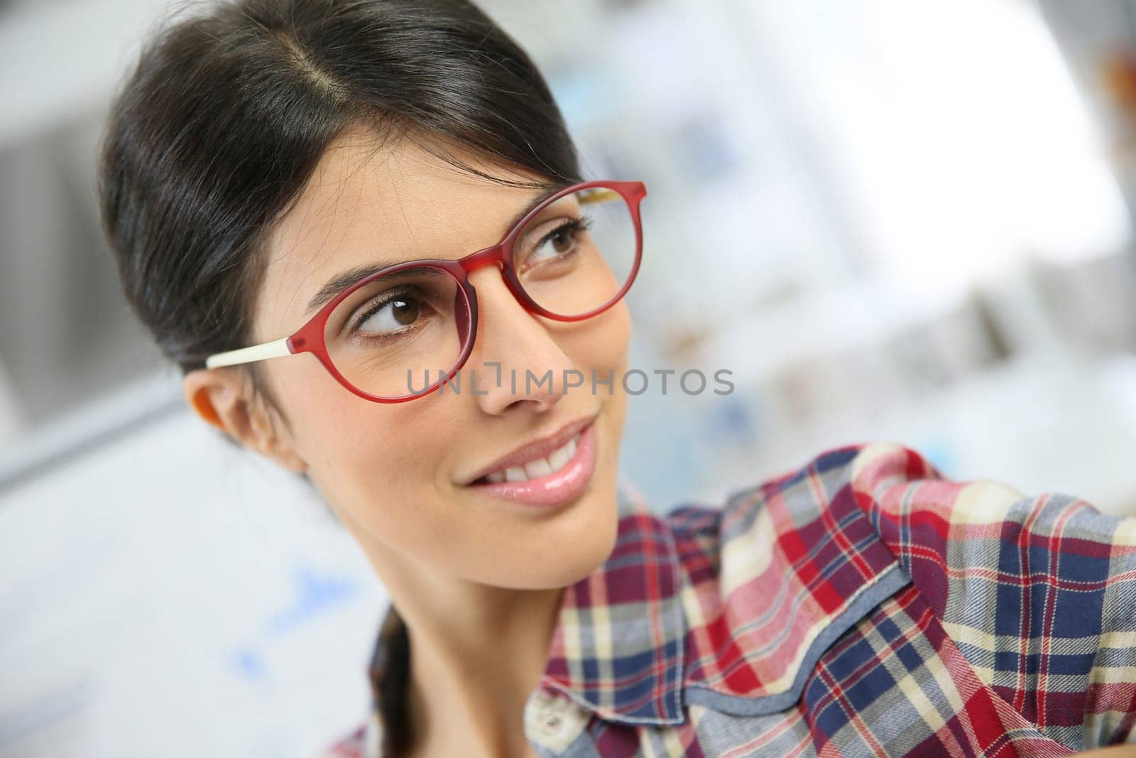 Portrait of office worker with eyeglasses on