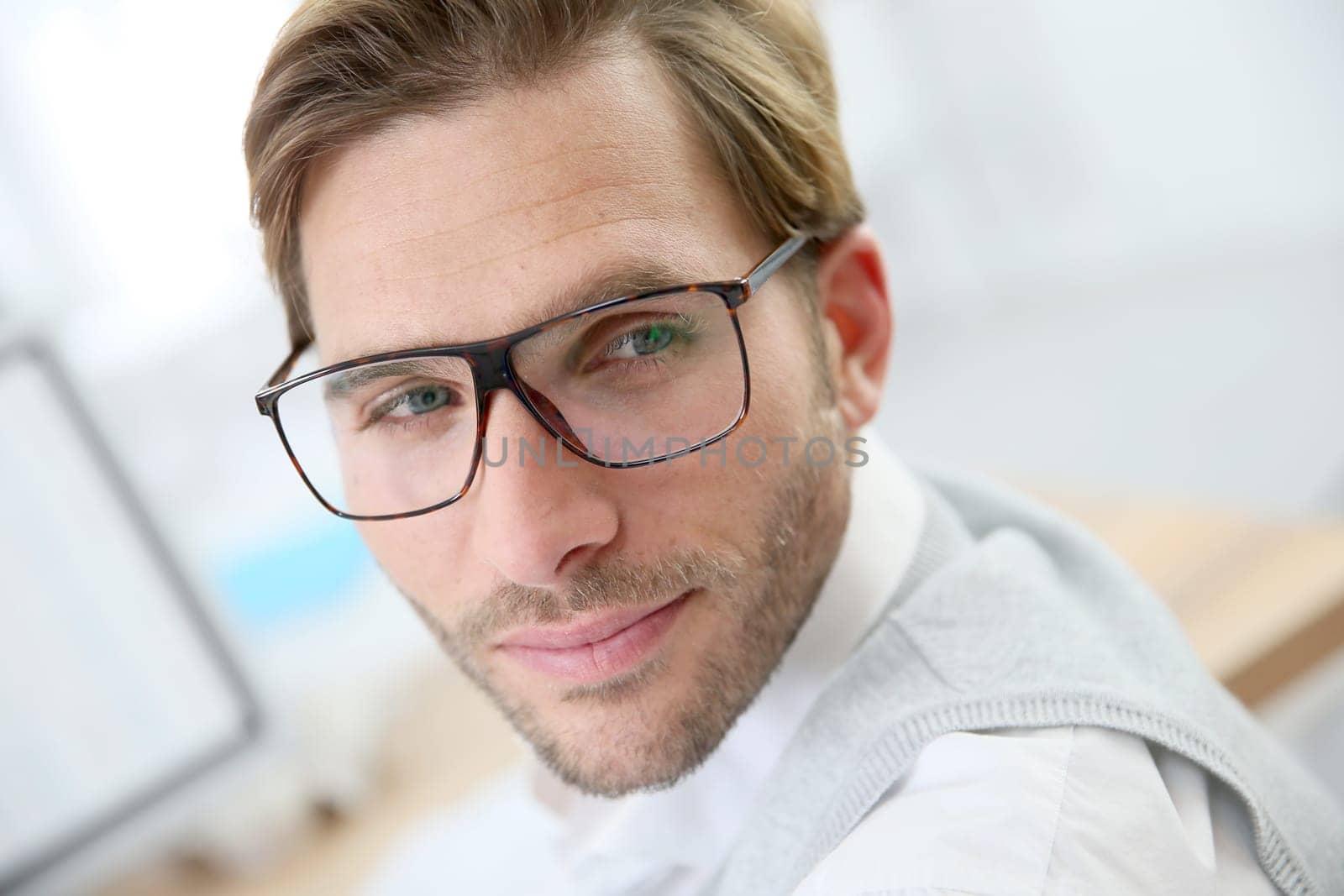 Businessman with eyeglasses working on desktop computer
