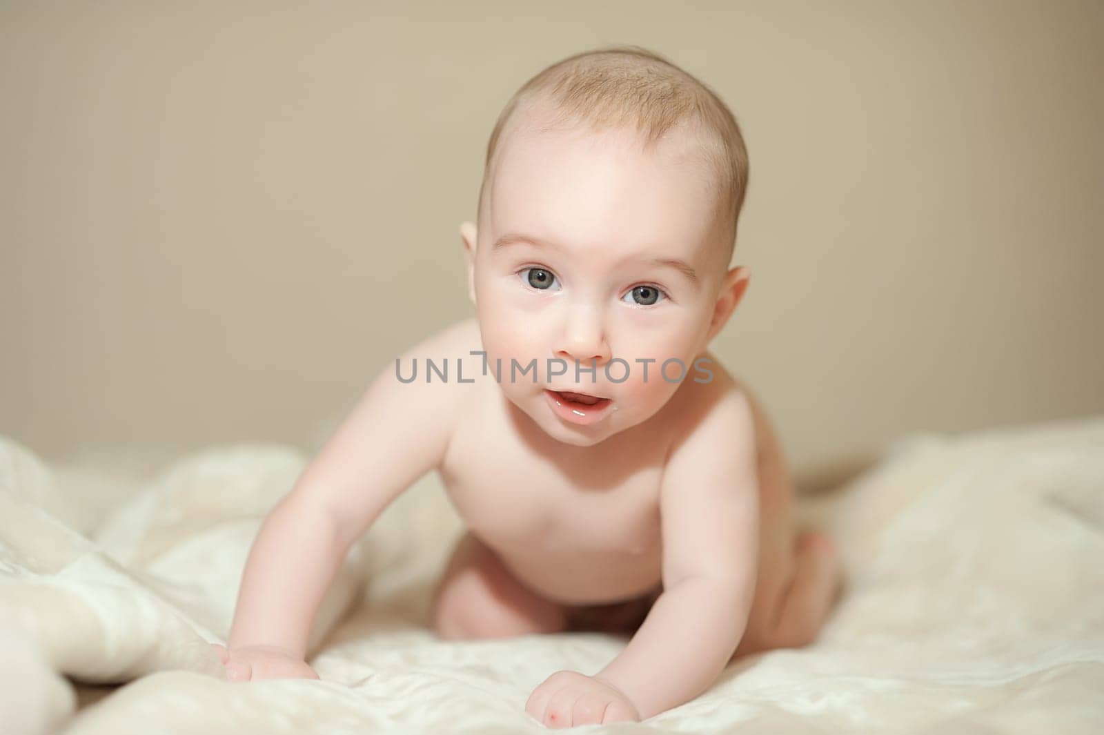 The little boy newborn baby smiling and drooling creeps and lies, Sleeps
