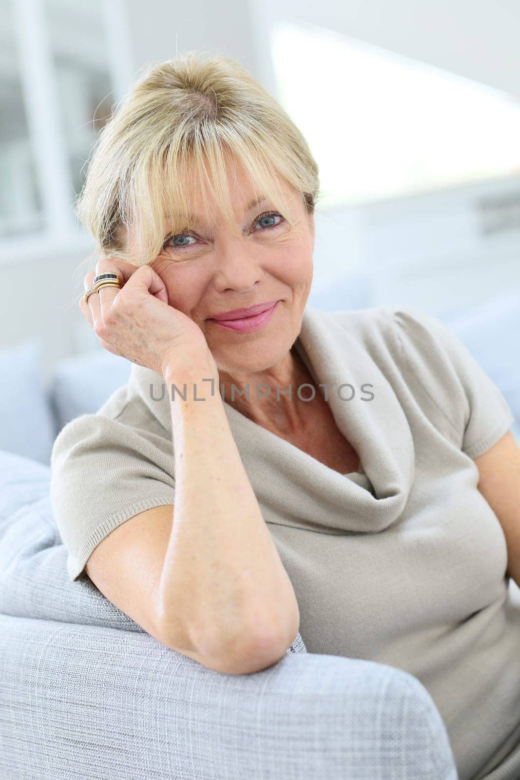 Portrait of senior woman relaxing in couch
