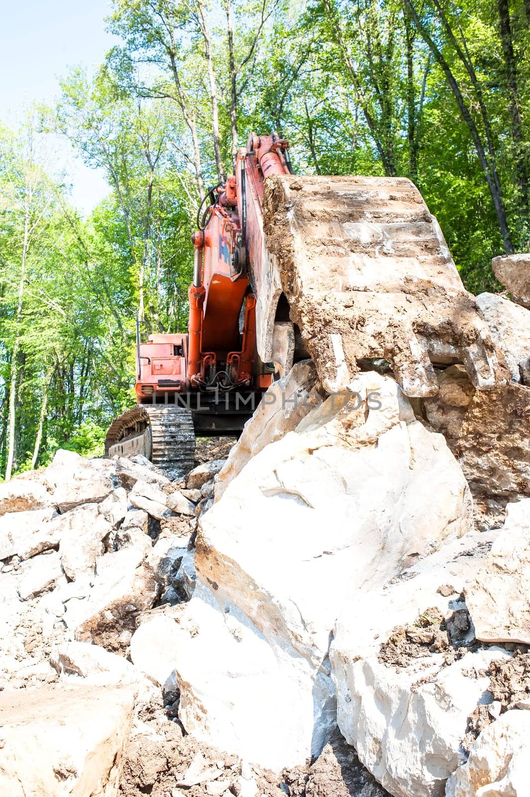 Excavator with big shovel to work with rocks