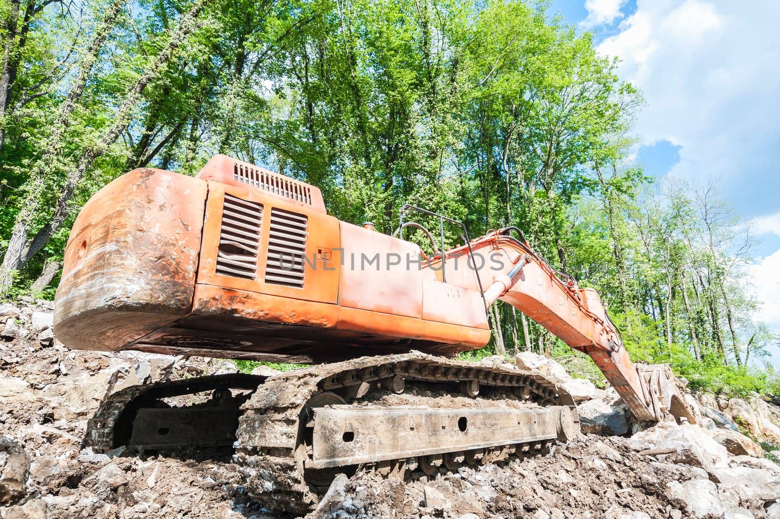 Excavator with big shovel to work with rocks