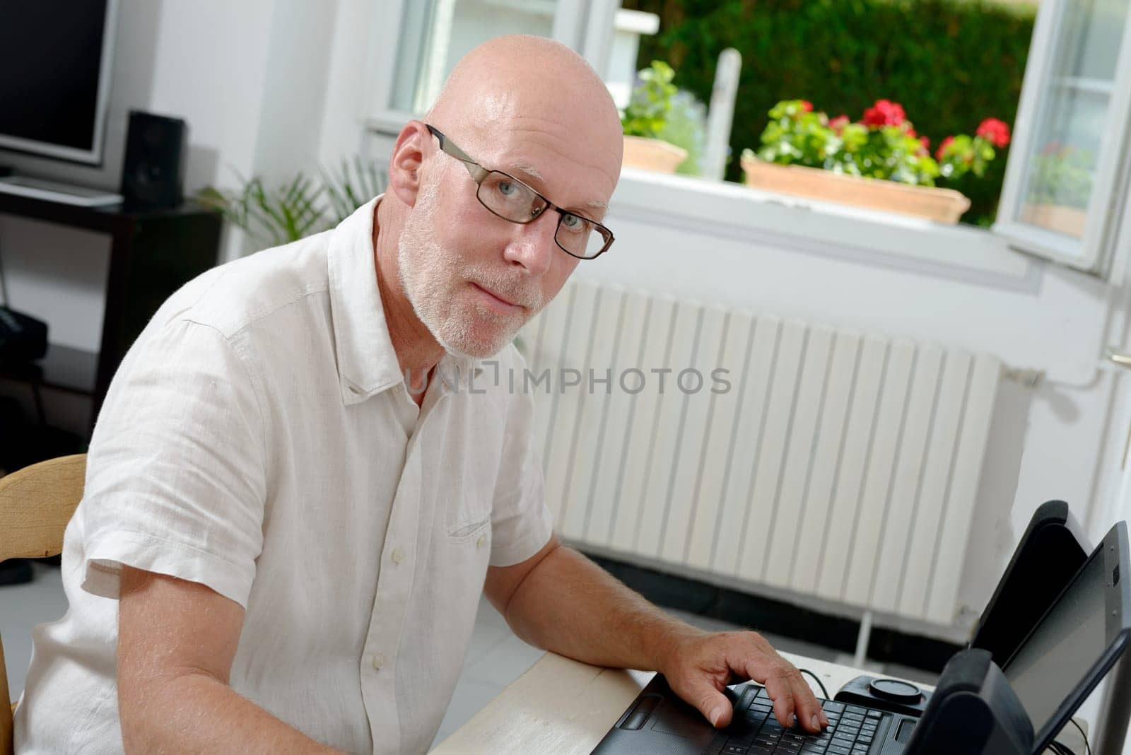 a portrait of a middle age man with laptop