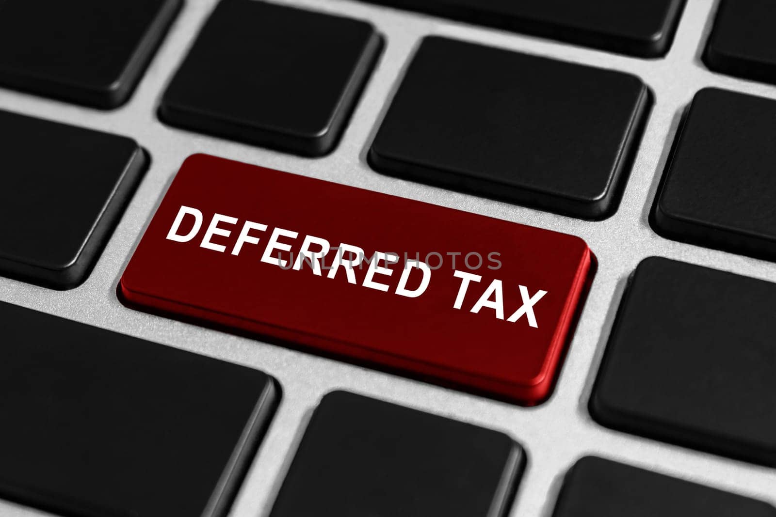 deferred tax red button on keyboard, business concept