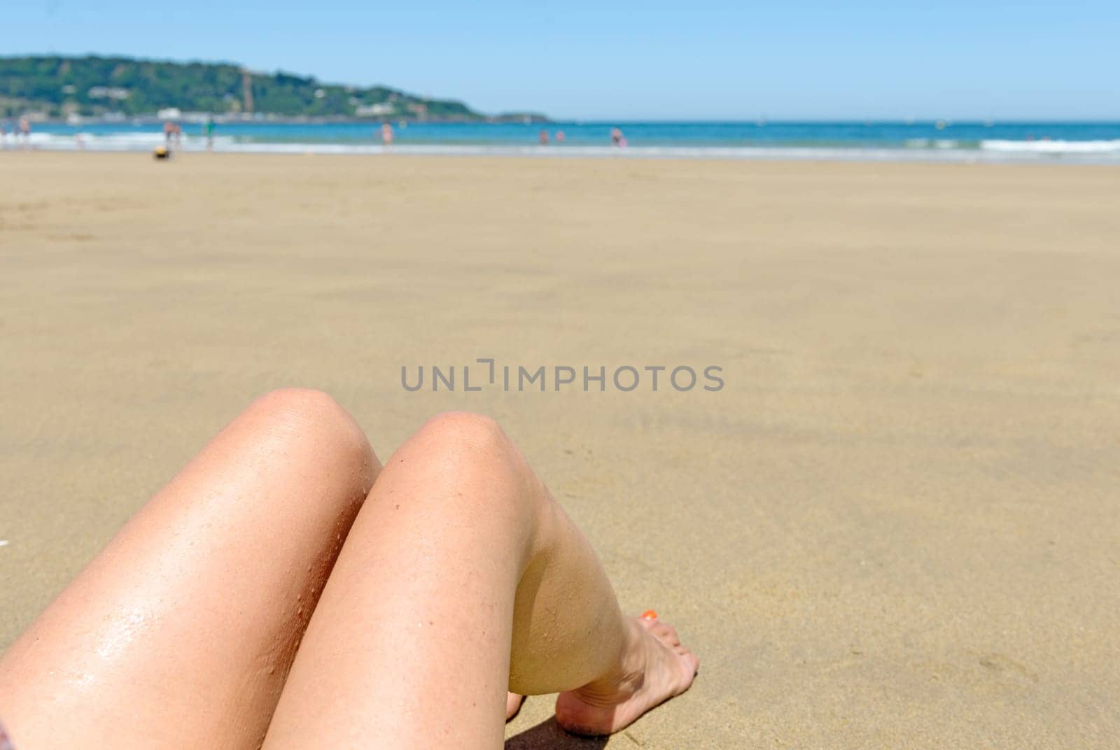 pretty woman's legs on the beach