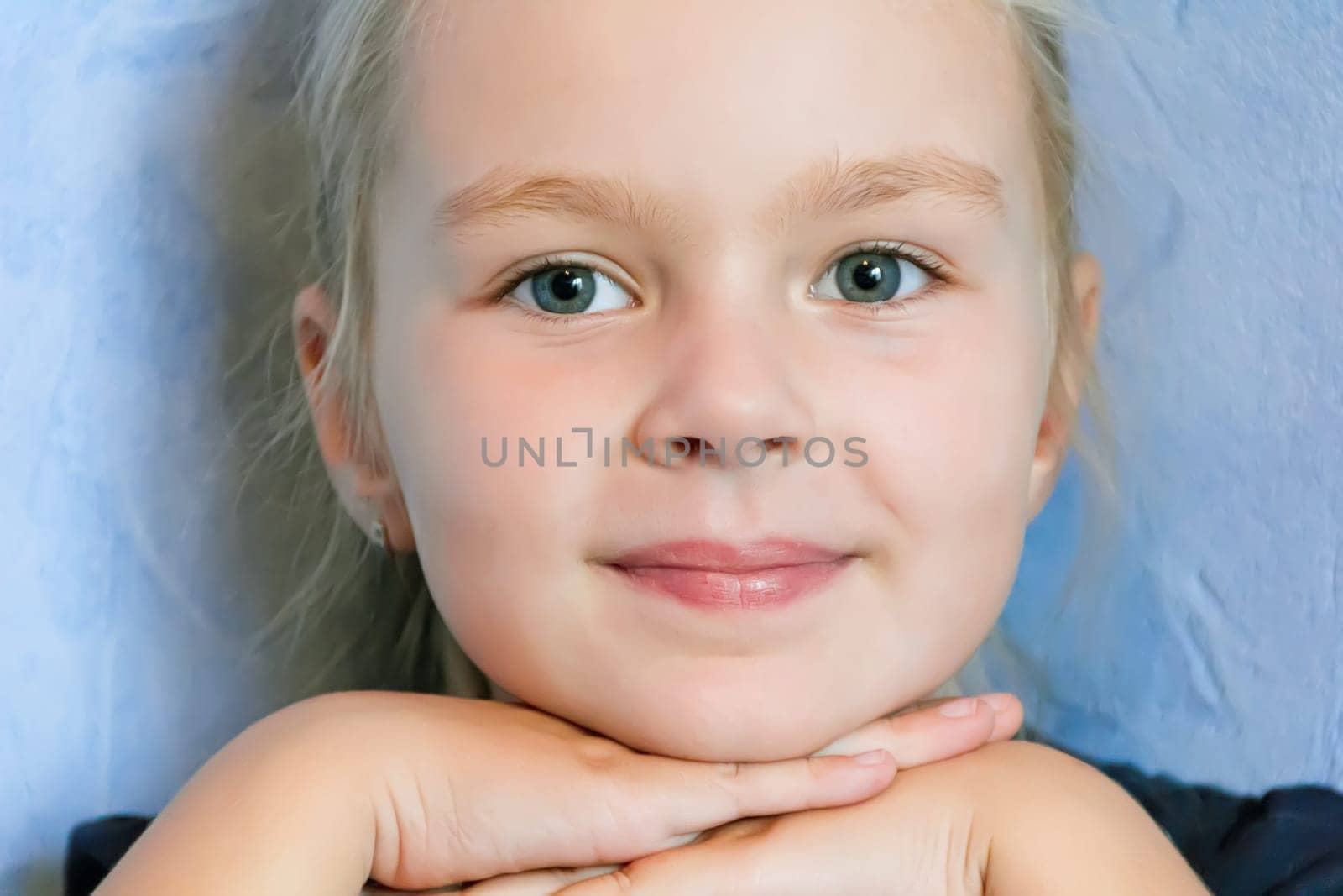 Portrait of cute girl with blond hair