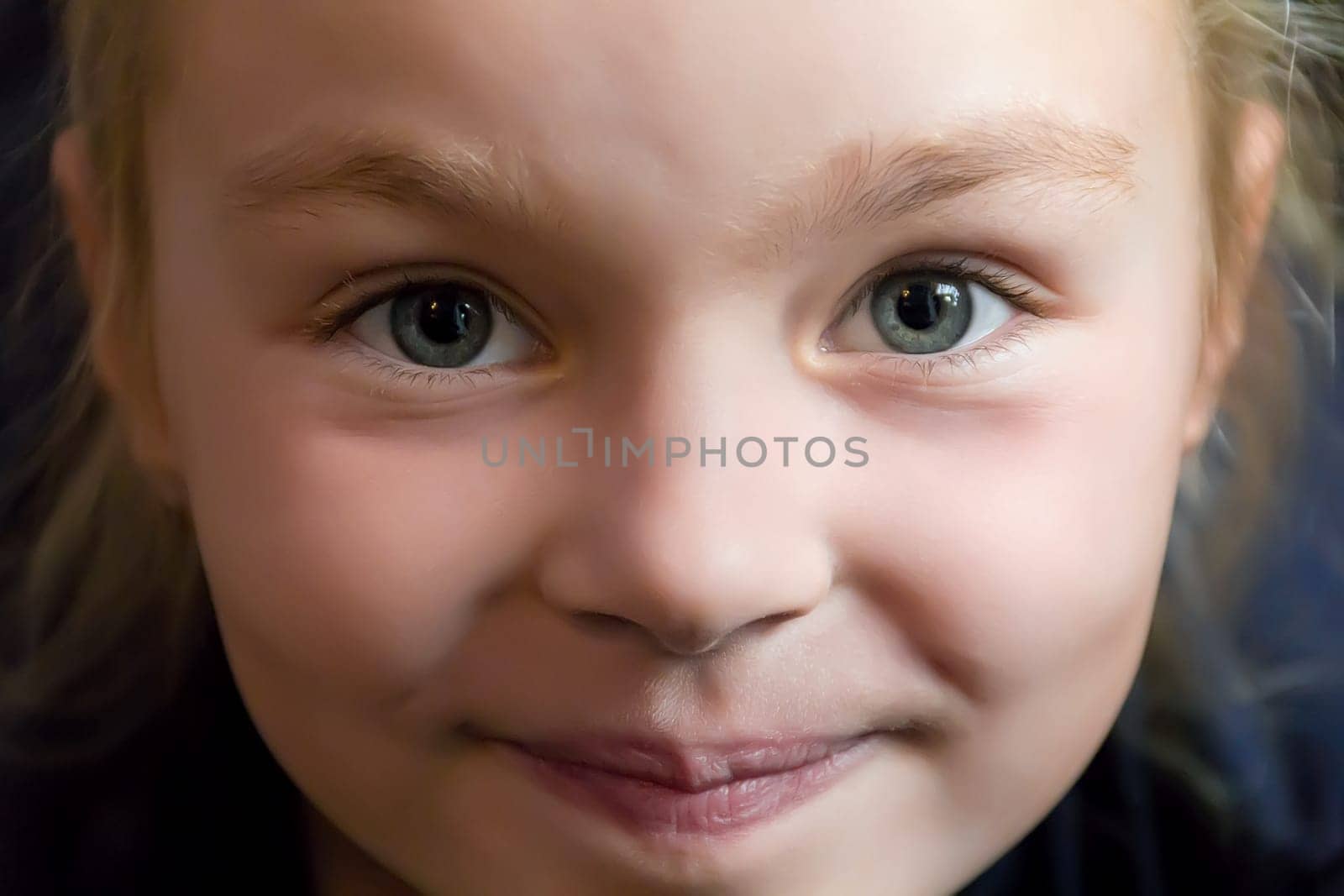 Portrait of cute girl with blond hair