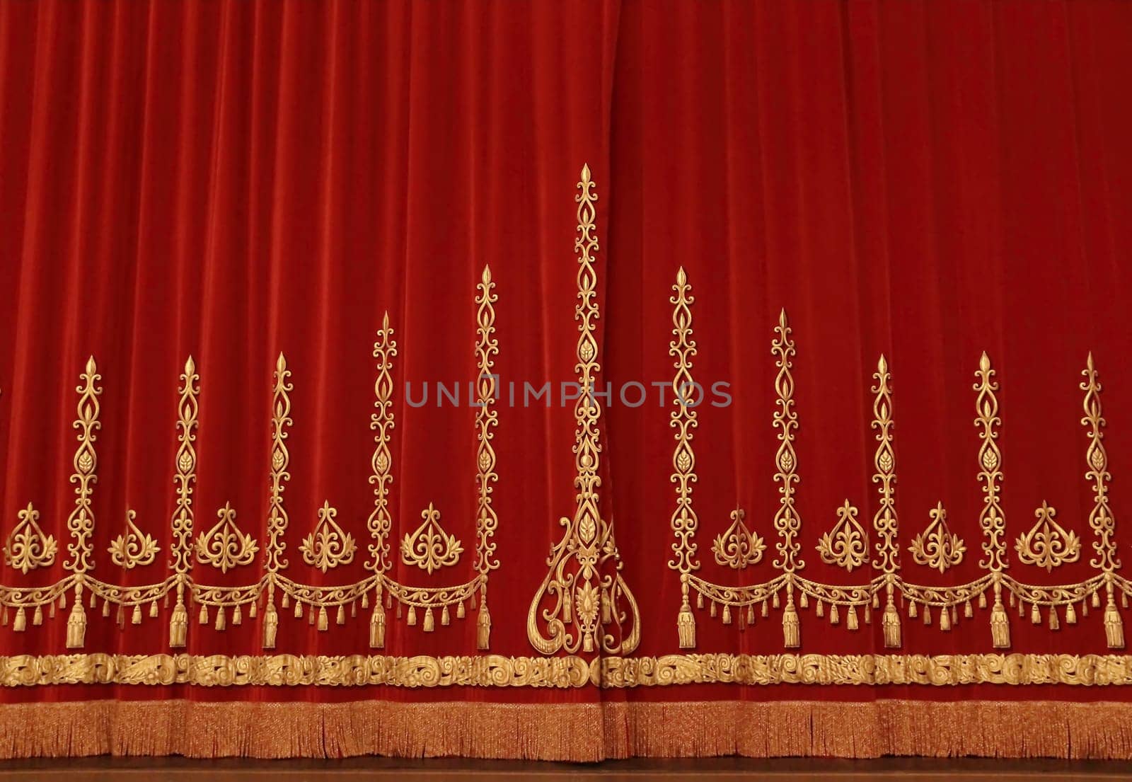 Theatrical red velvet curtain with gold pattern