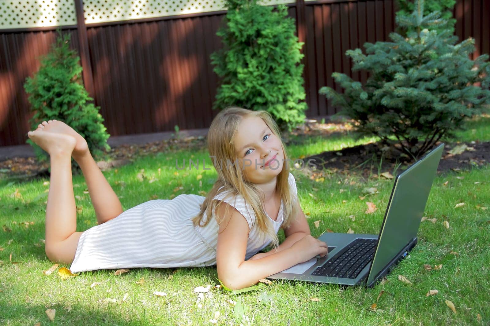 Image of girl with laptop in summer
