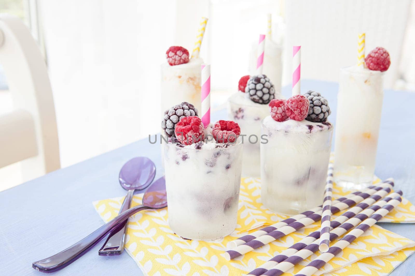 Homemade vanilla yogurt ice cream with berries
