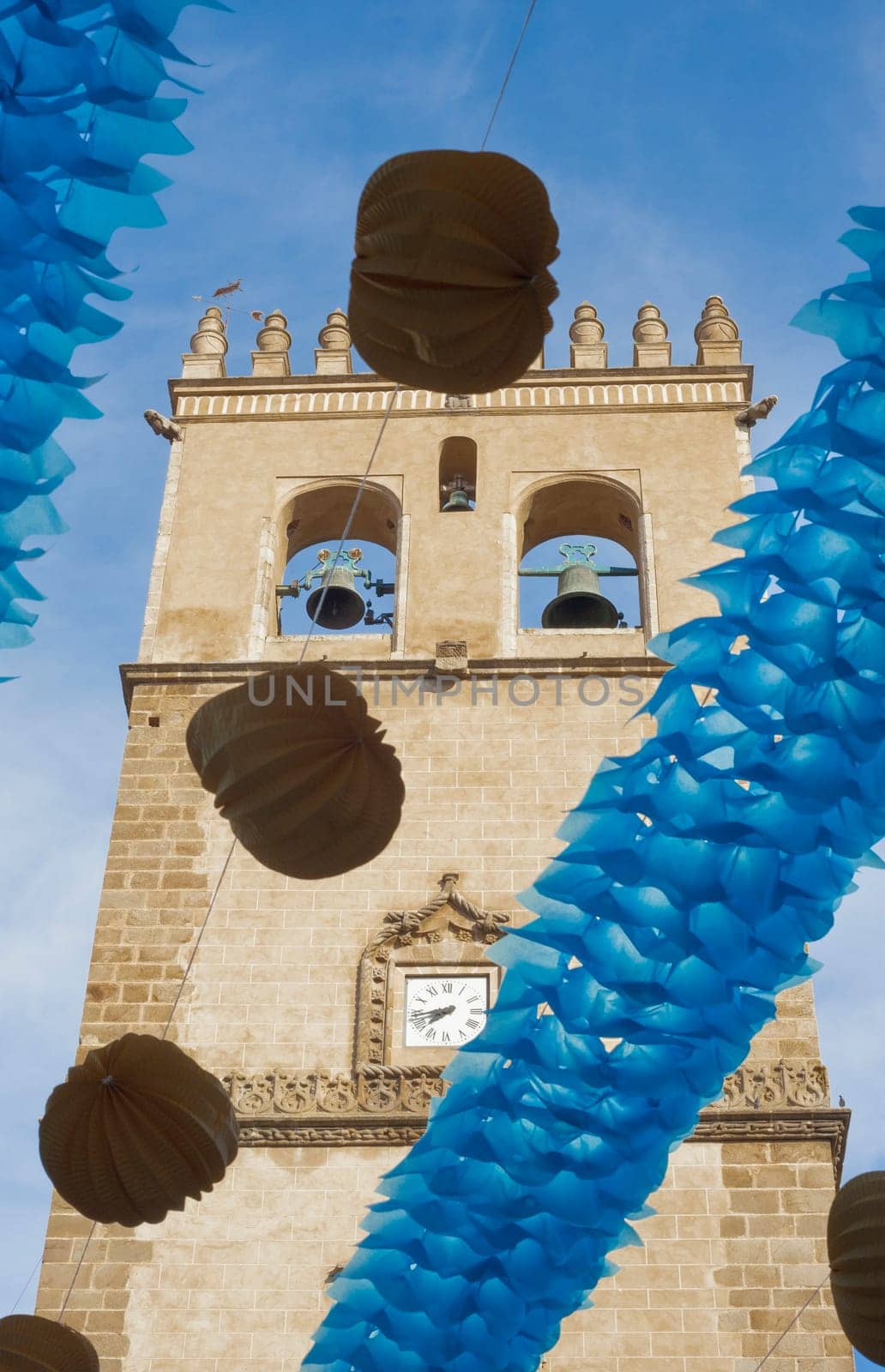 Badajoz Cathedral tower between paper lanterns during San Juan Festivities Fair