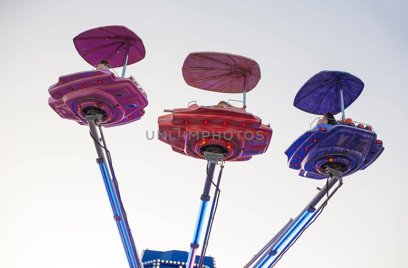 Vintage ship space funfair attraction at dusk, Spain
