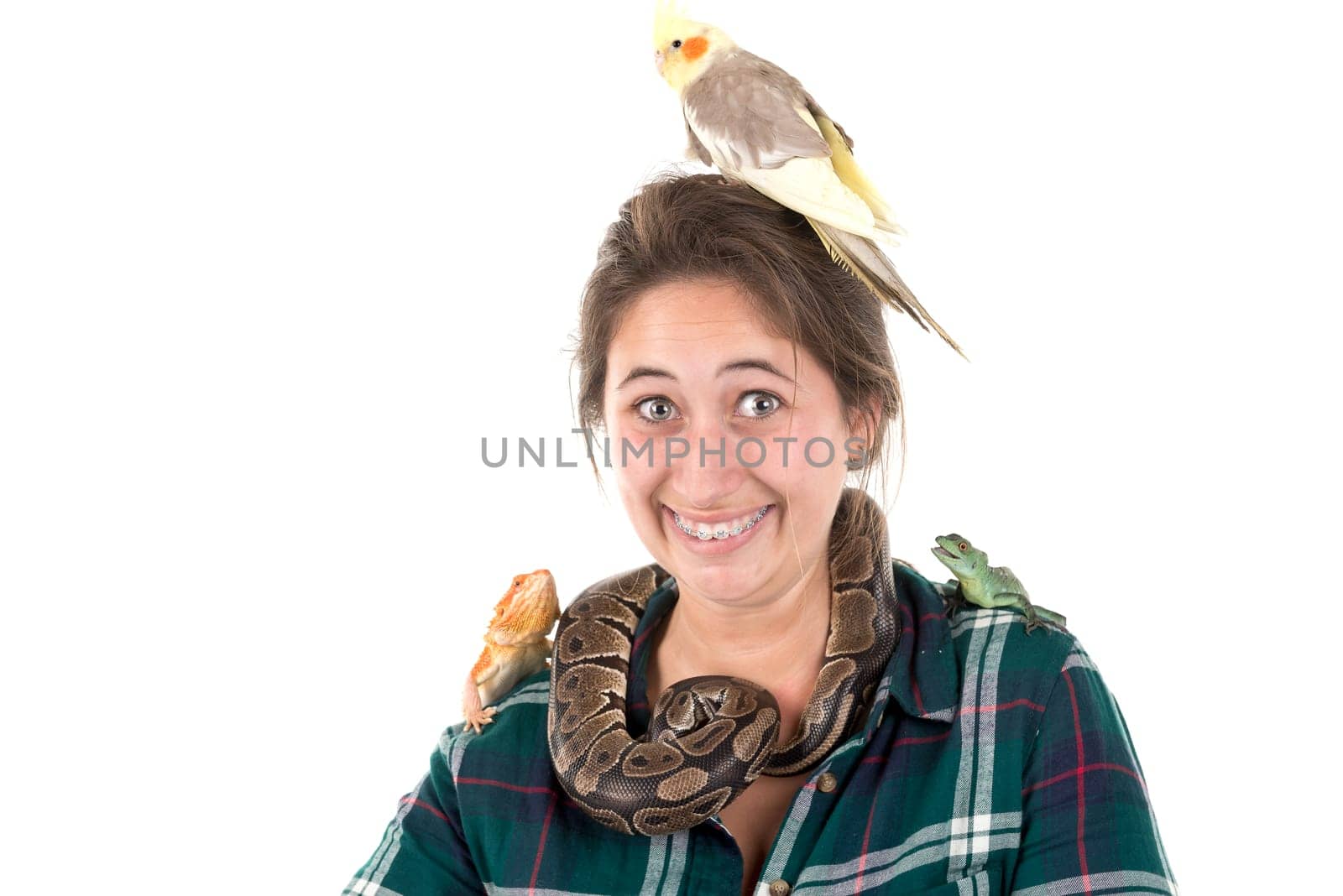Girl with several pet animals isolated in white