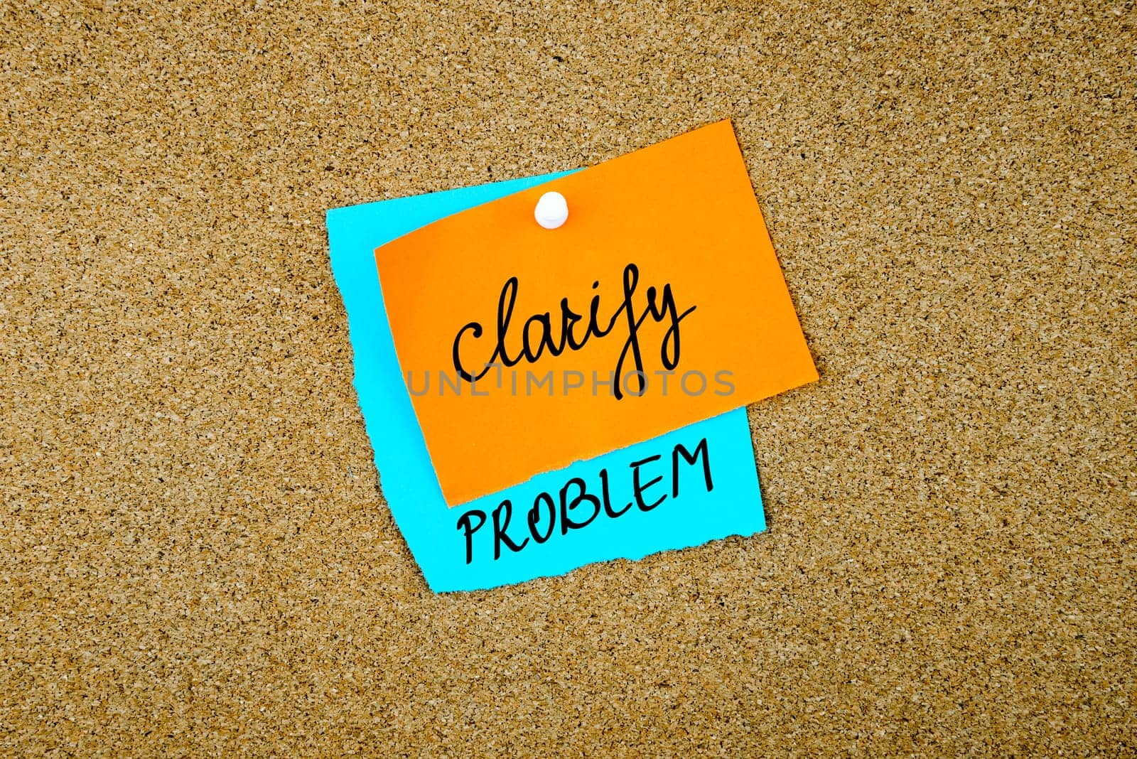 Clarify Problem written on paper notes pinned on cork board with white thumb tack, copy space available