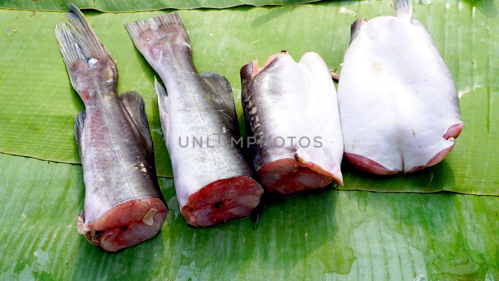 fish pieces on banana leaf in fresh market Luang Prabang, Laos
