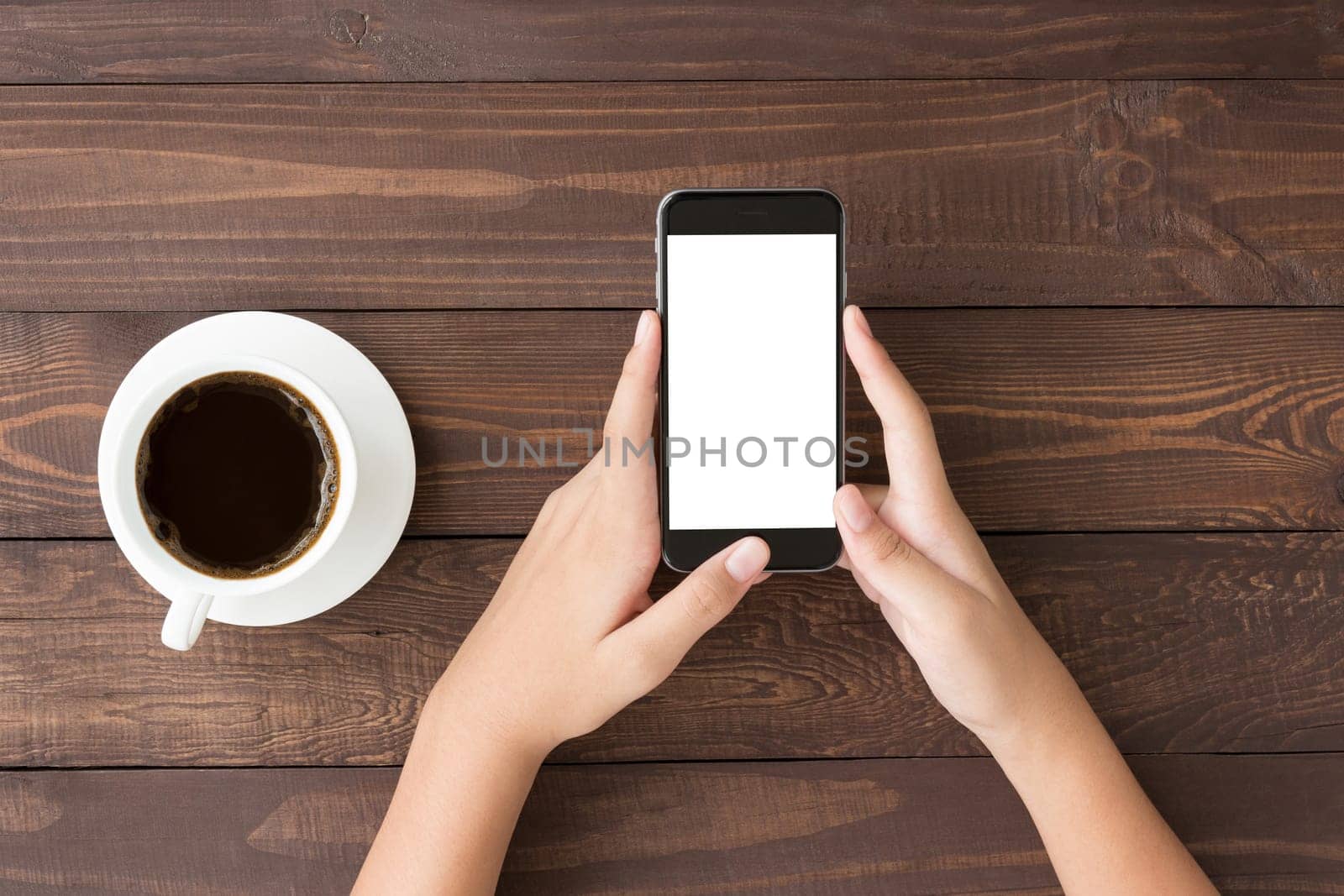 phone white screen in woman hand on table top view