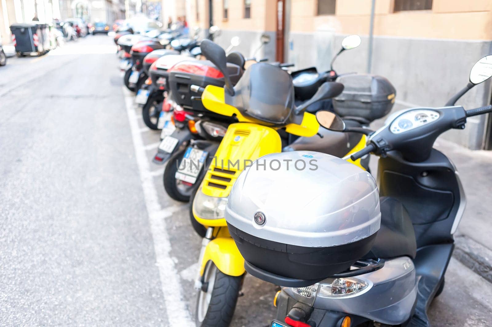 Trieste ,Italy - April 22 2016 : Motorbike, motorcycle scooters parked in row in city street.