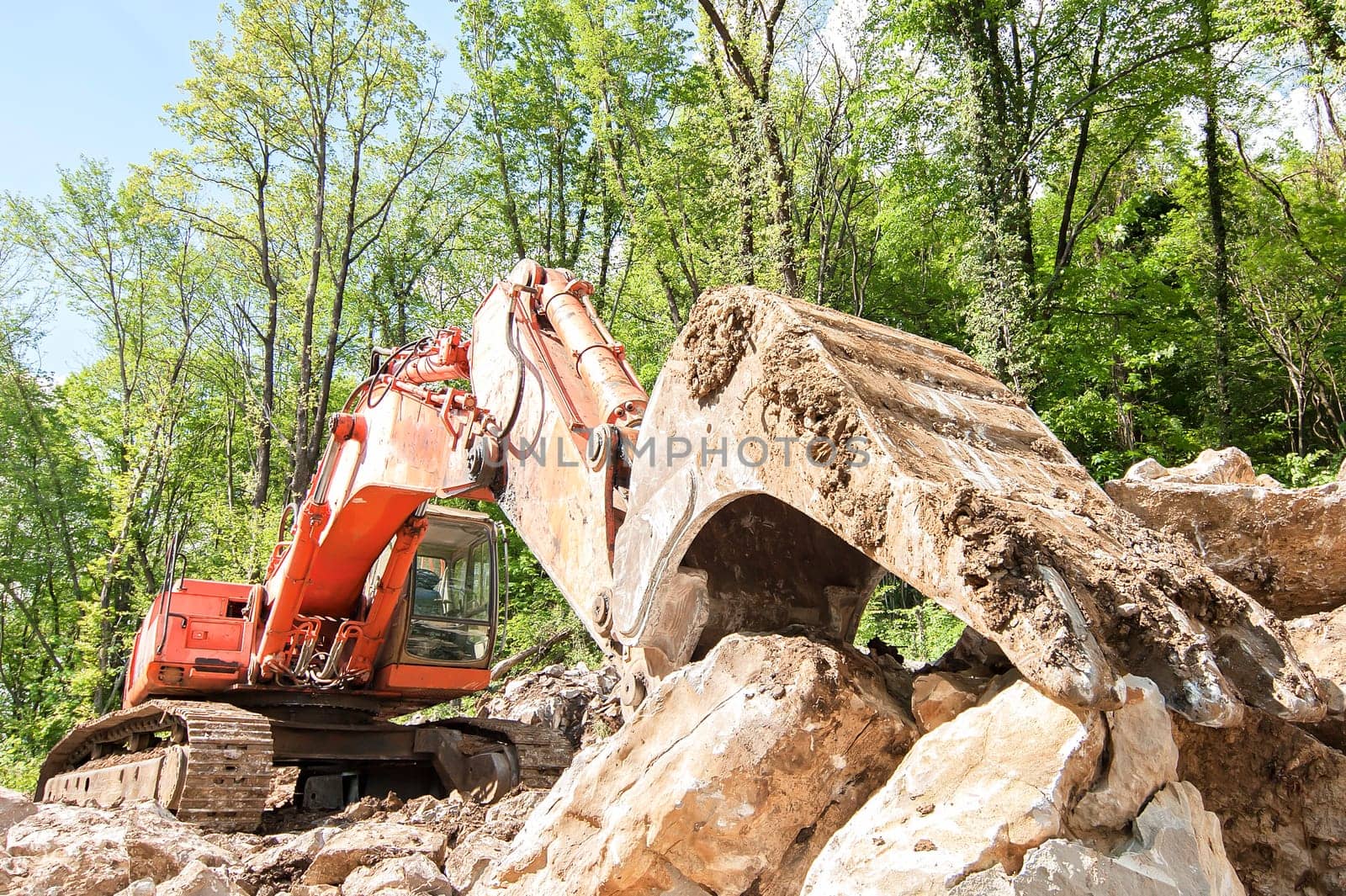 Excavator with big shovel to work with rocks