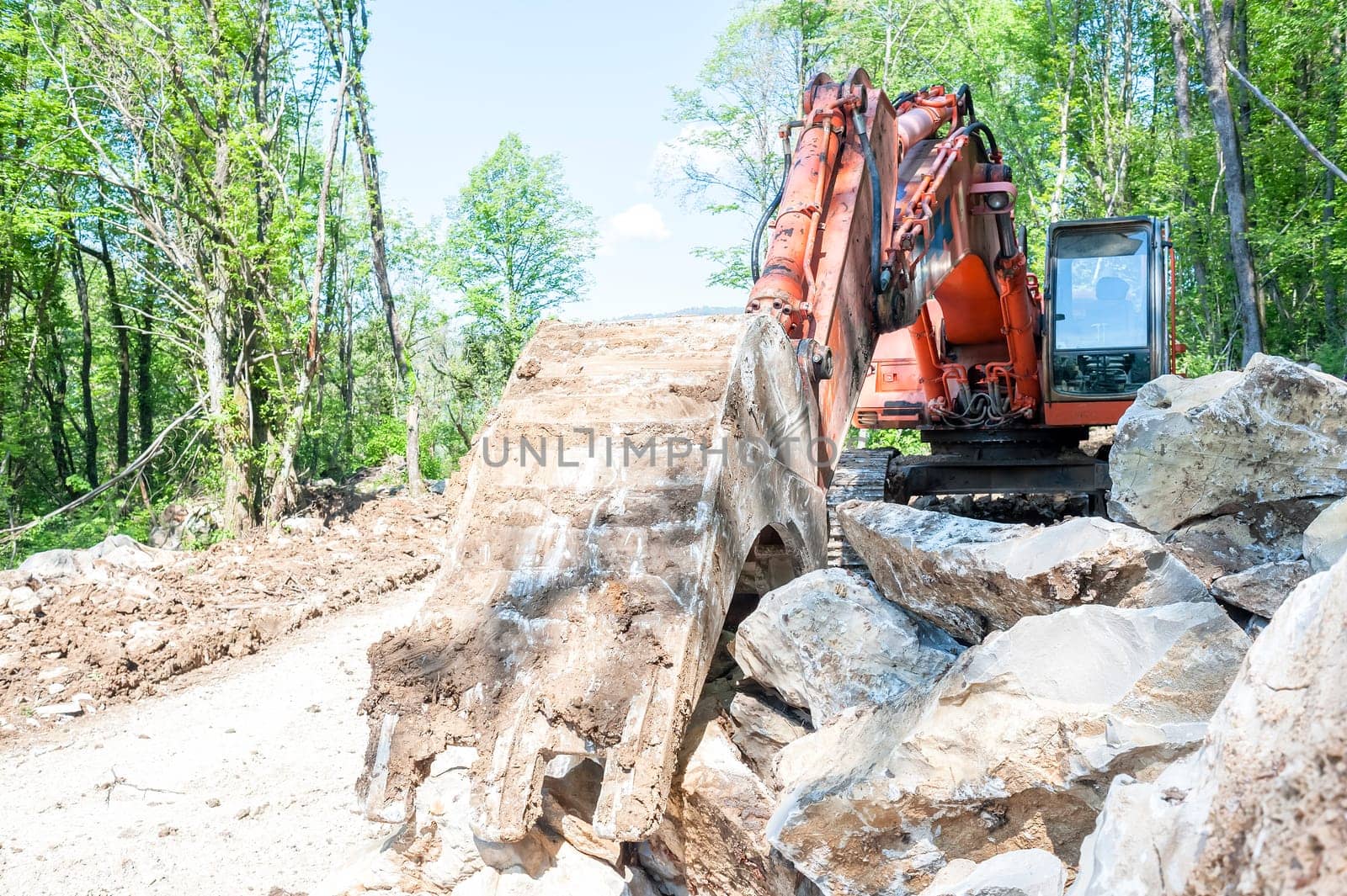 Excavator with big shovel to work with rocks