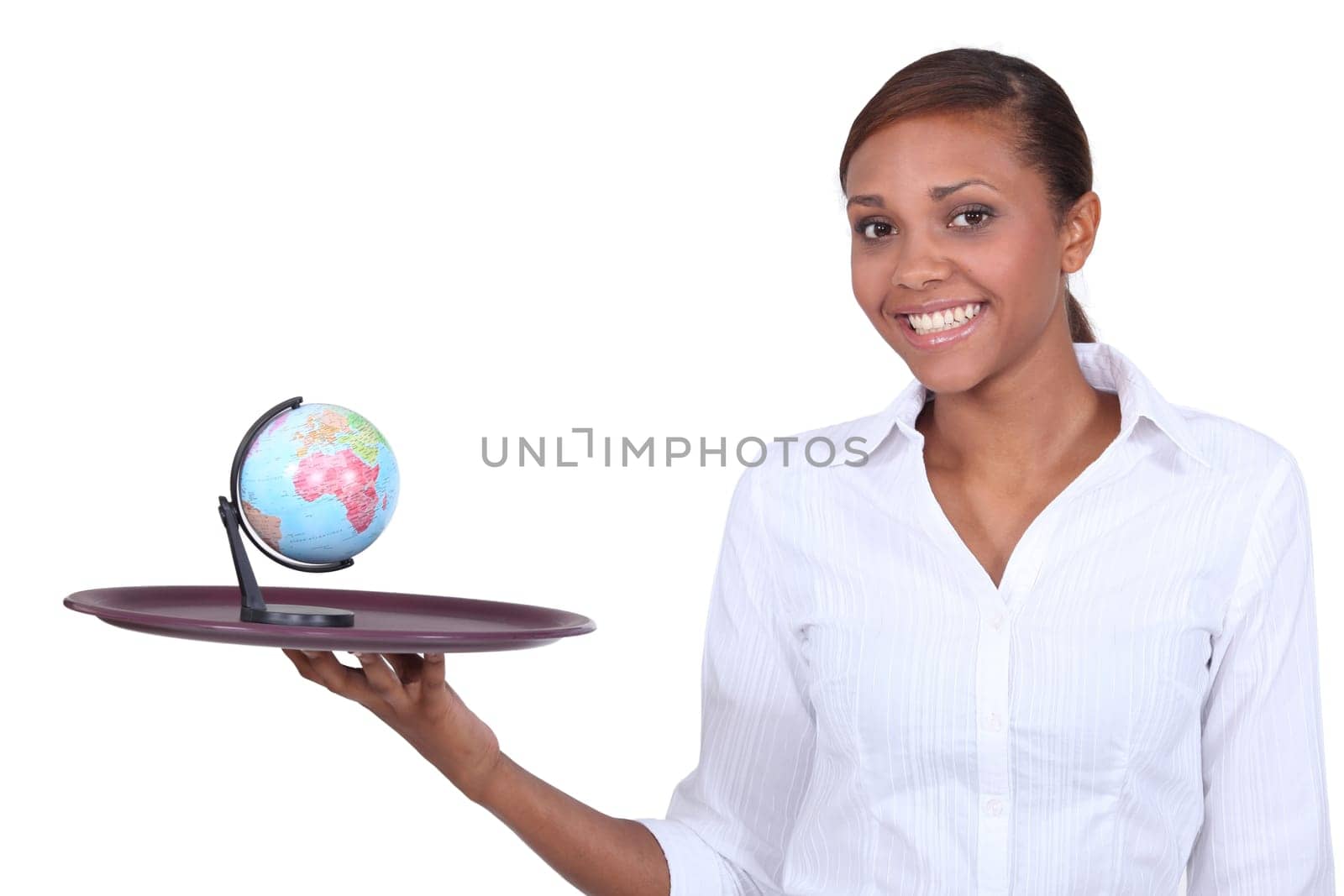 Woman holding miniature globe on tray