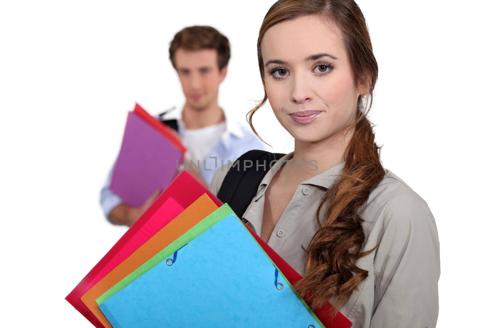 Students carrying folders