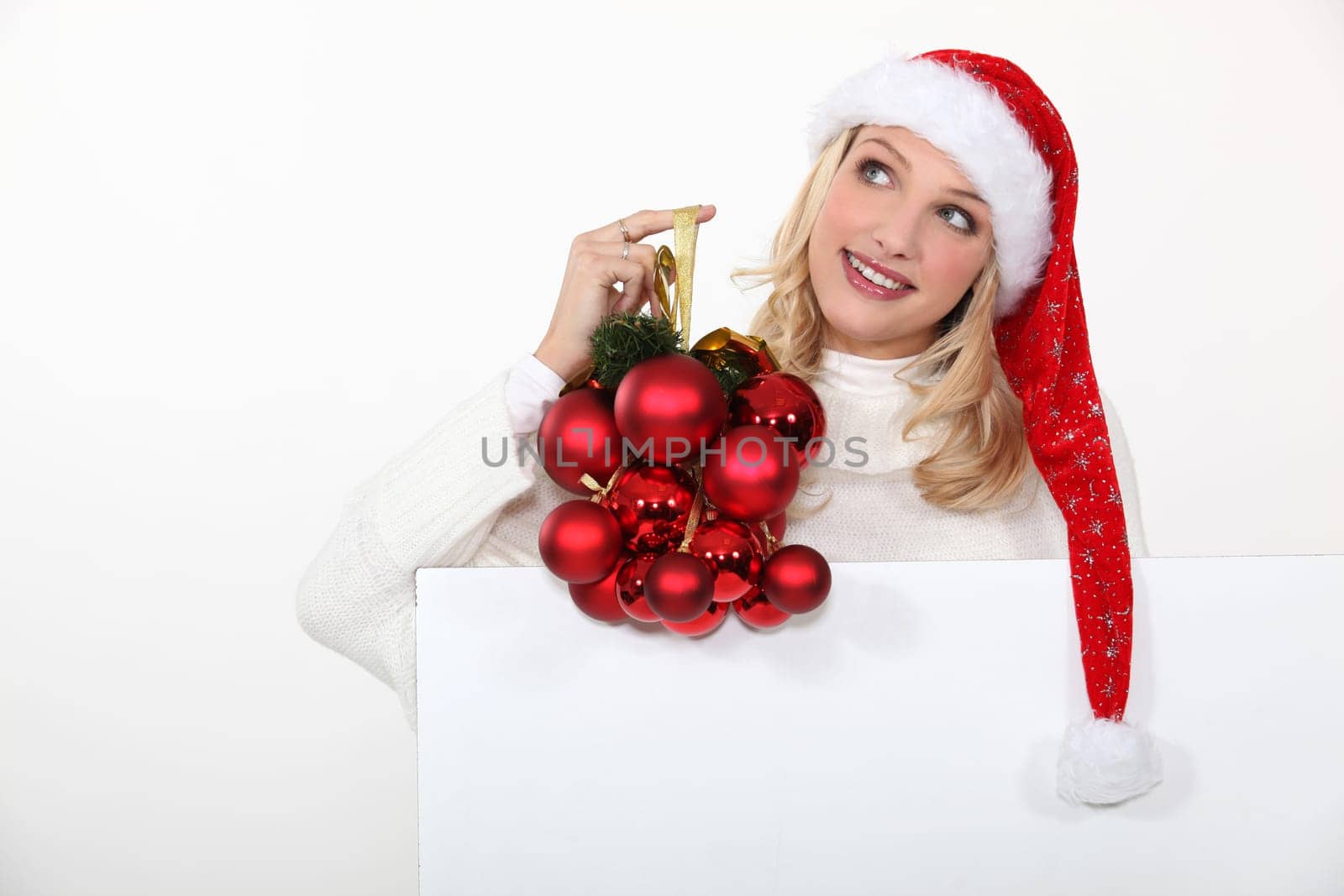 Woman holding Christmas ornaments