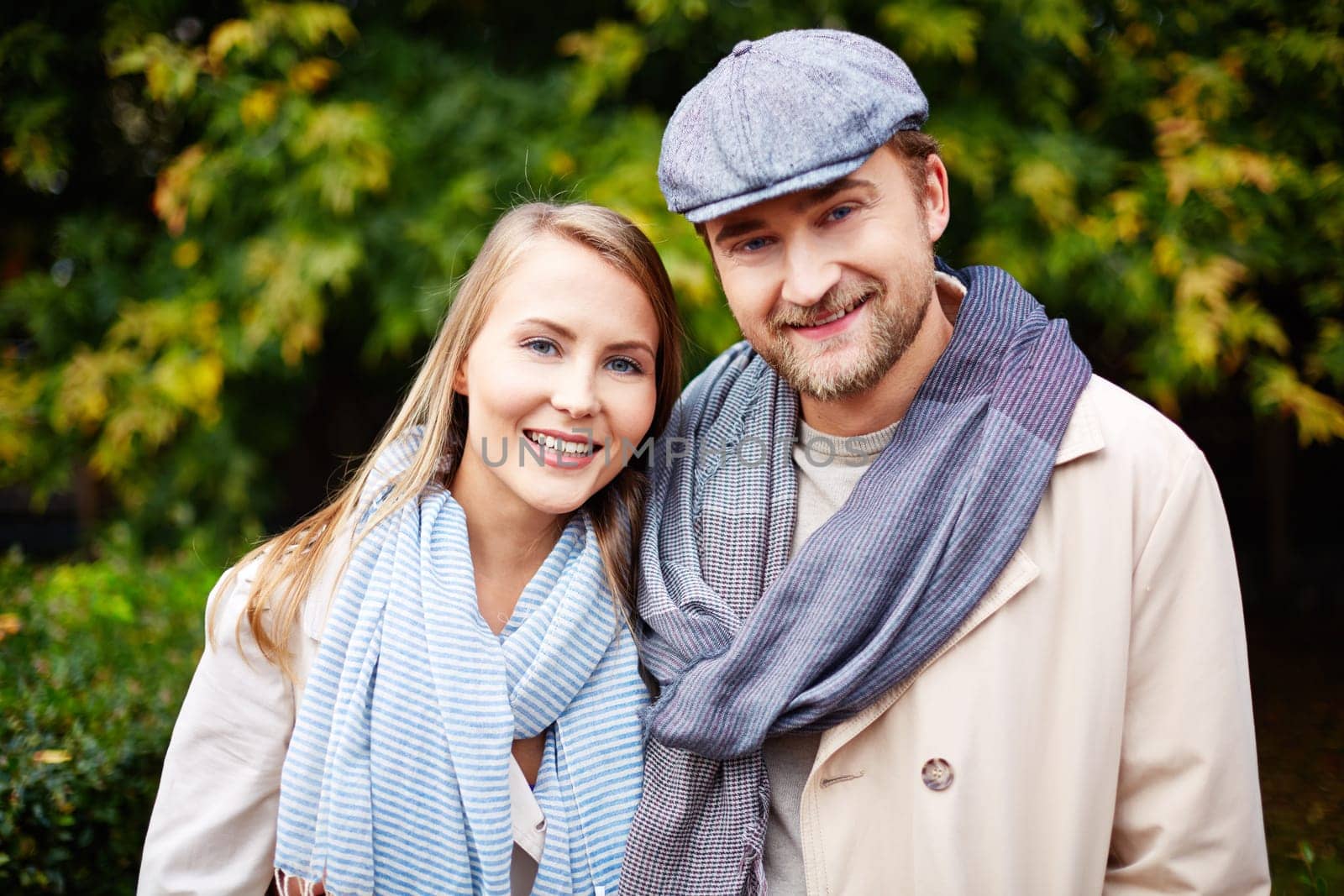 Stylish young man and woman looking at camera