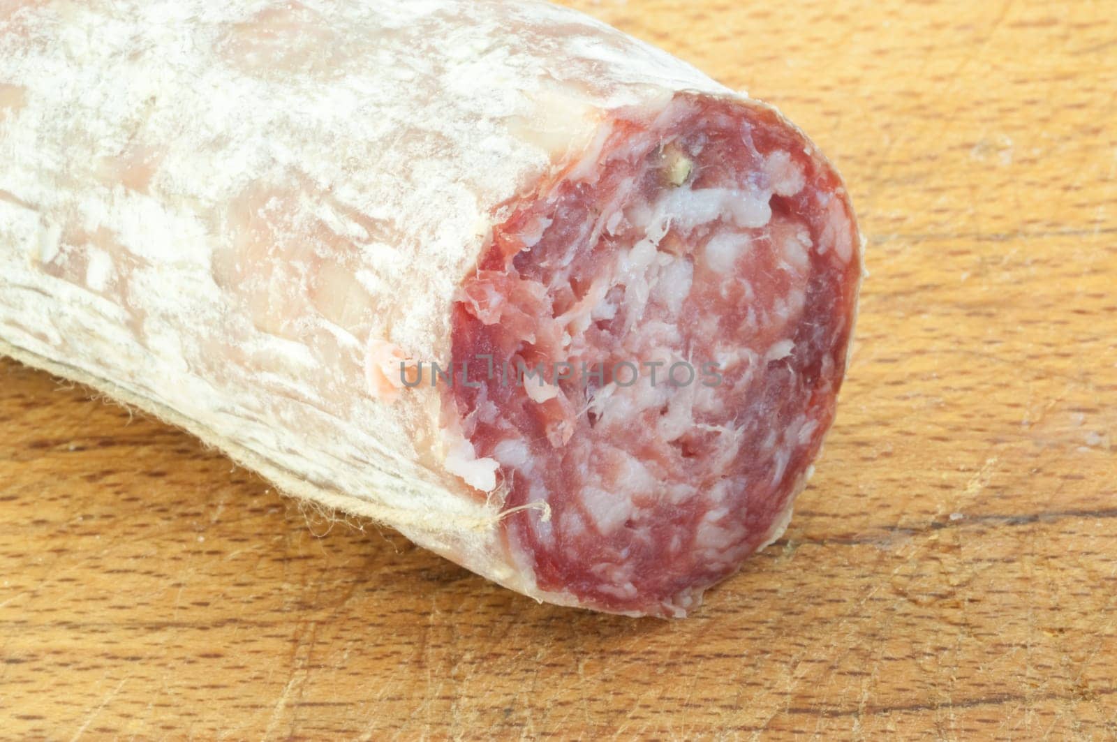 beautiful macro background of a salami on a cutting board