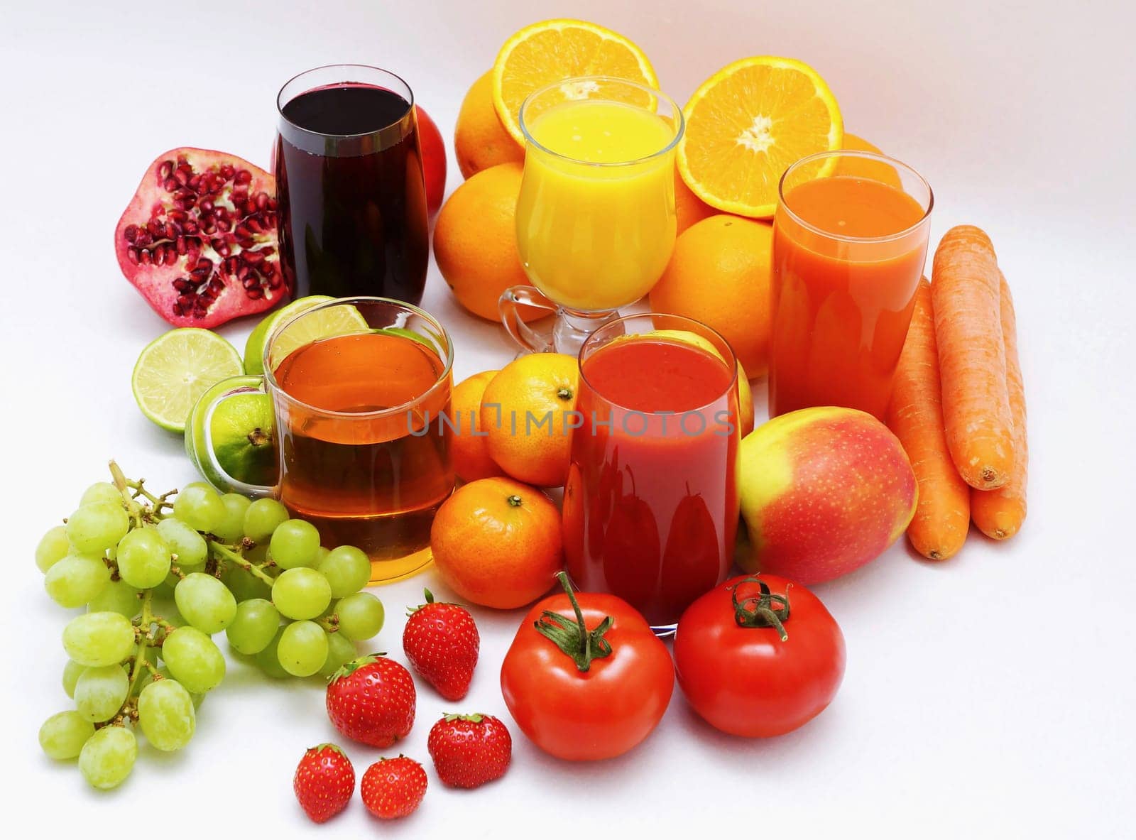 Organic fruit and fruit juice on a white background