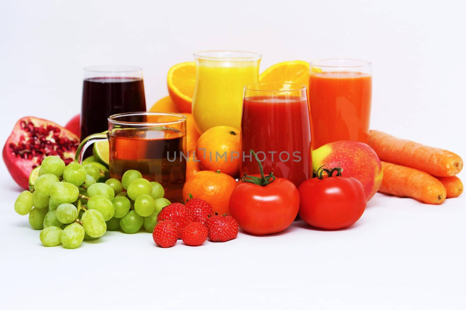 Organic fruit and fruit juice on a white background