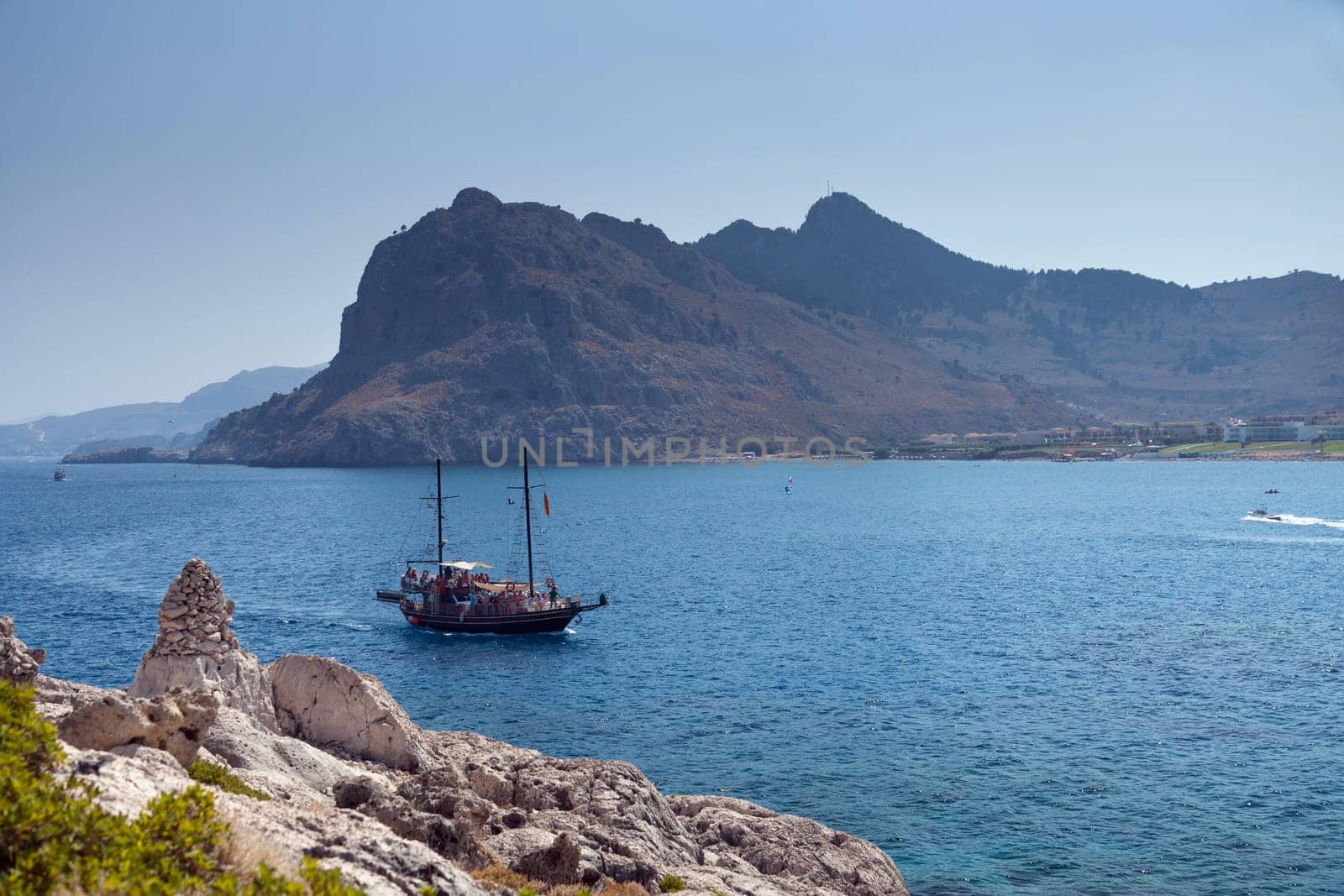 Kolymbia beach with the rocky coast in Greece.