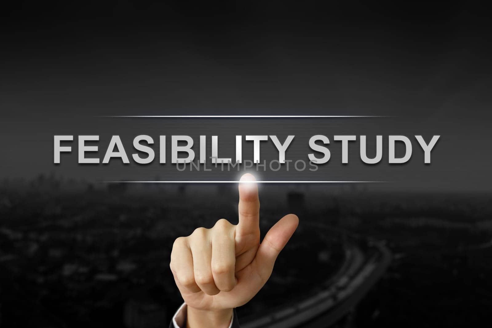 business hand clicking feasibility study button on black blurred background