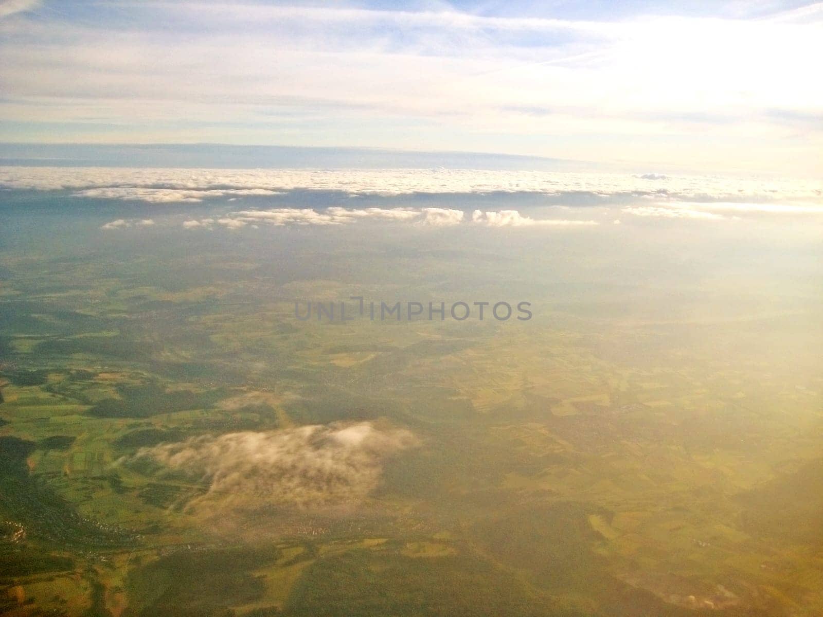 Flight over green landscape - sunrise / sunset