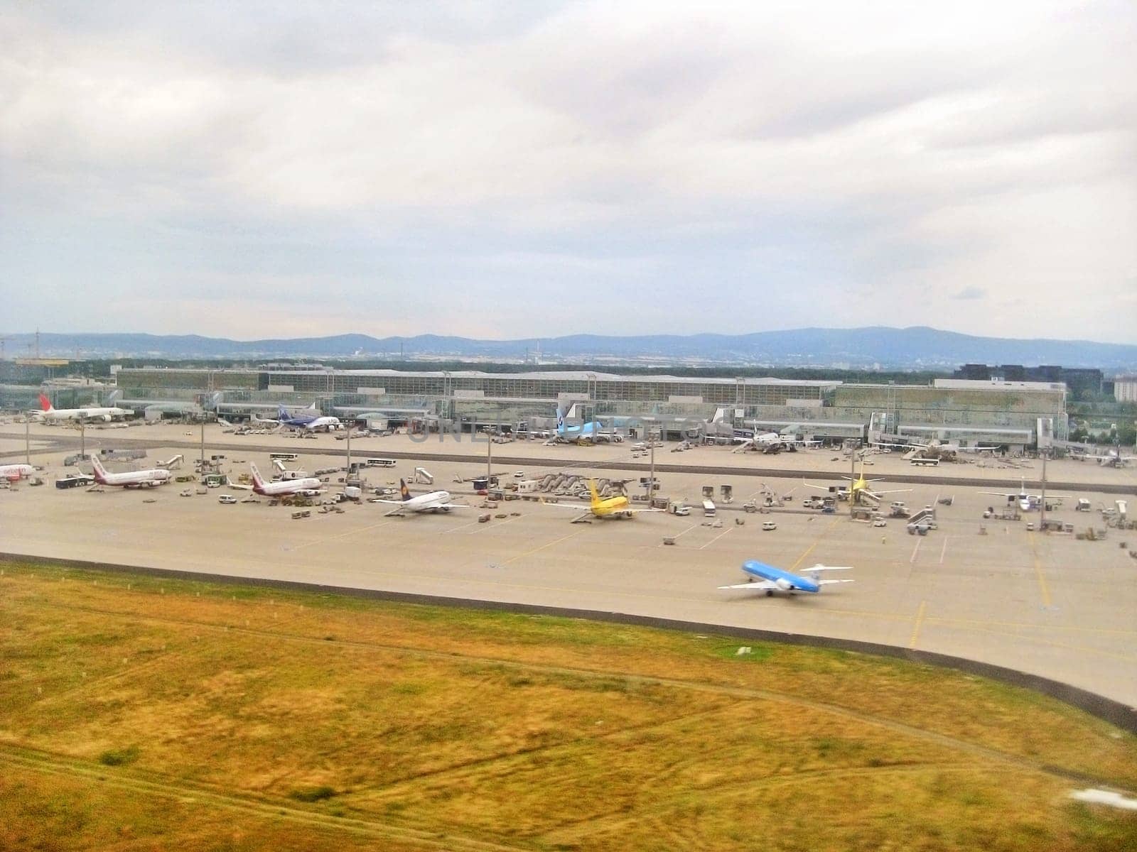 Frankfurt am Main, Germany - July 9, 2008: Airport Frankfurt / Main - Terminal with airplanes in parking position. View from runway during landing.
