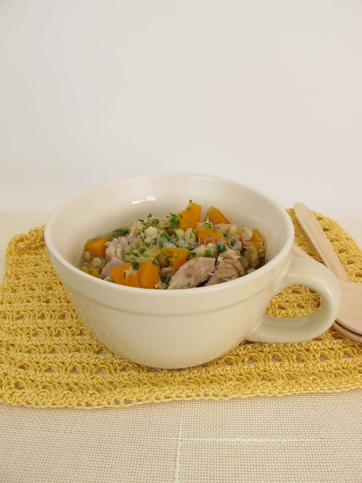 Stew with vegetables,barley and lentils in meat broth